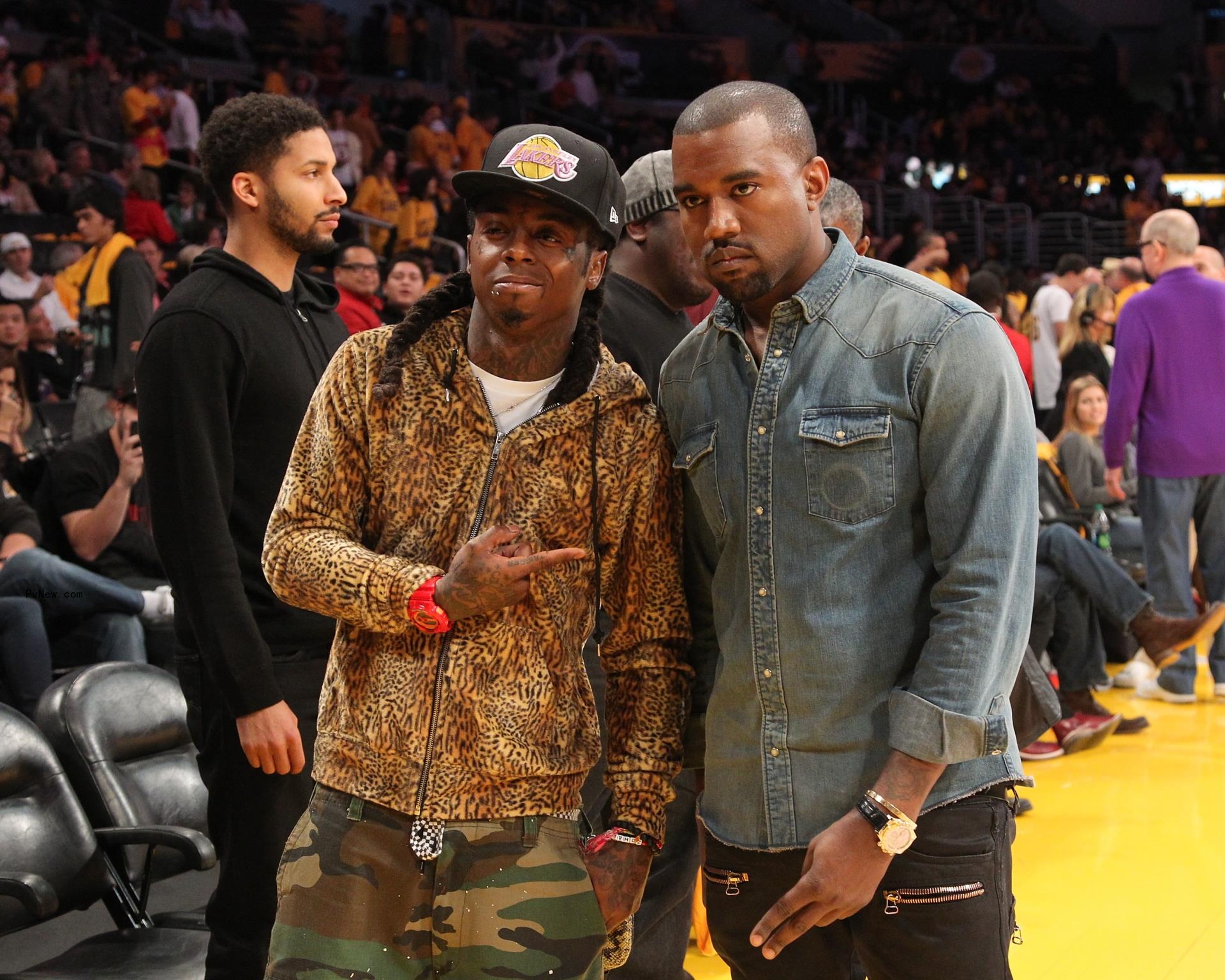 Lil Wayne and Kanye West (R) attend the Los Angeles Lakers vs Chicago Bulls game on December 25, 2011 in Los Angeles, California.