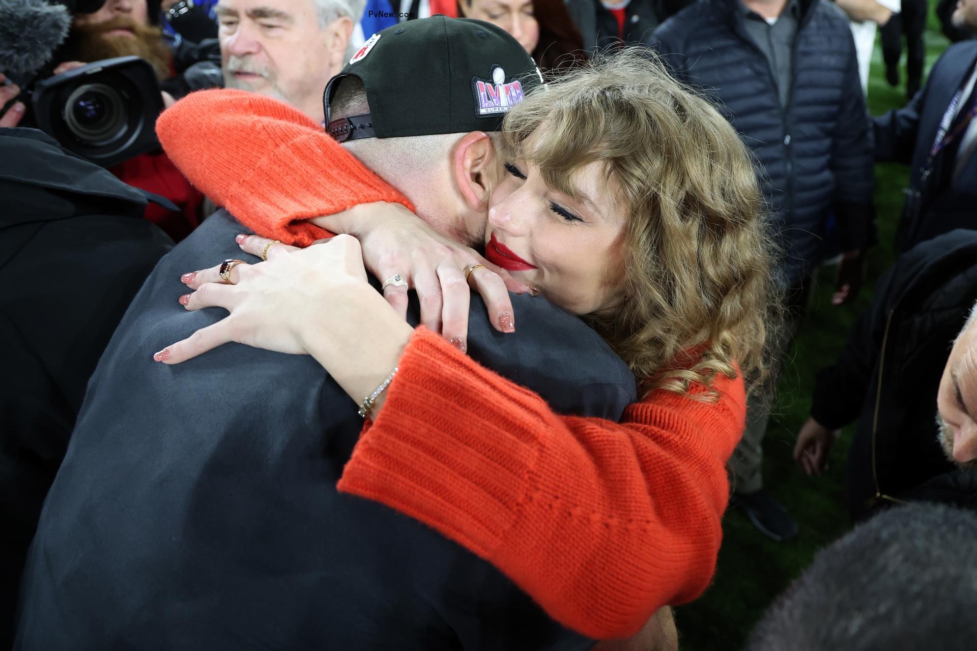 Travis Kelce #87 of the Kansas City Chiefs celebrates with Taylor Swift after a 17-10 victory against the Baltimore Ravens in the AFC Champio<i></i>nship Game in January 2024.