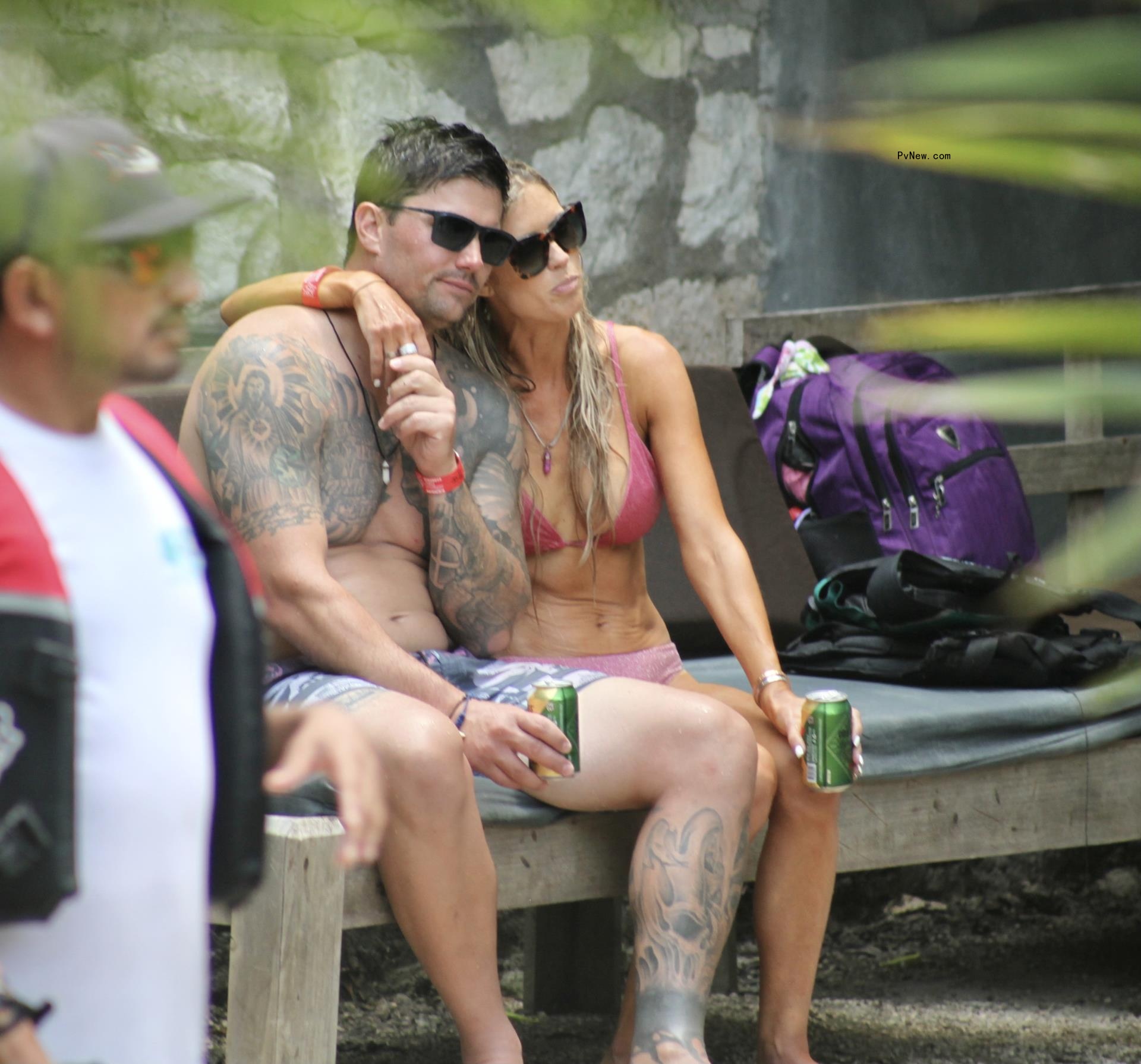 Christina Hall puts her arm around Josh Hall.