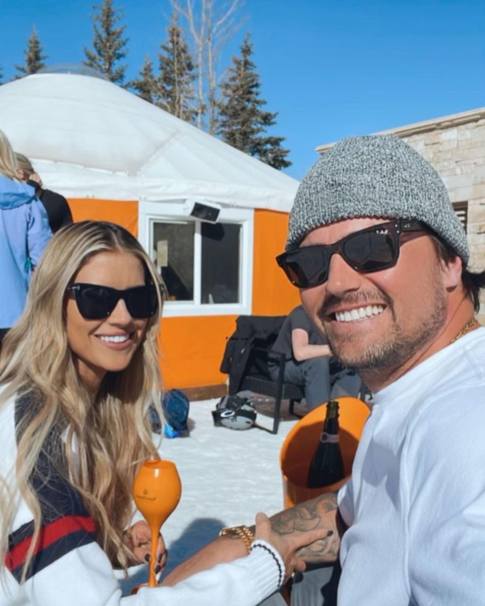 Christina and Josh Hall posing together.