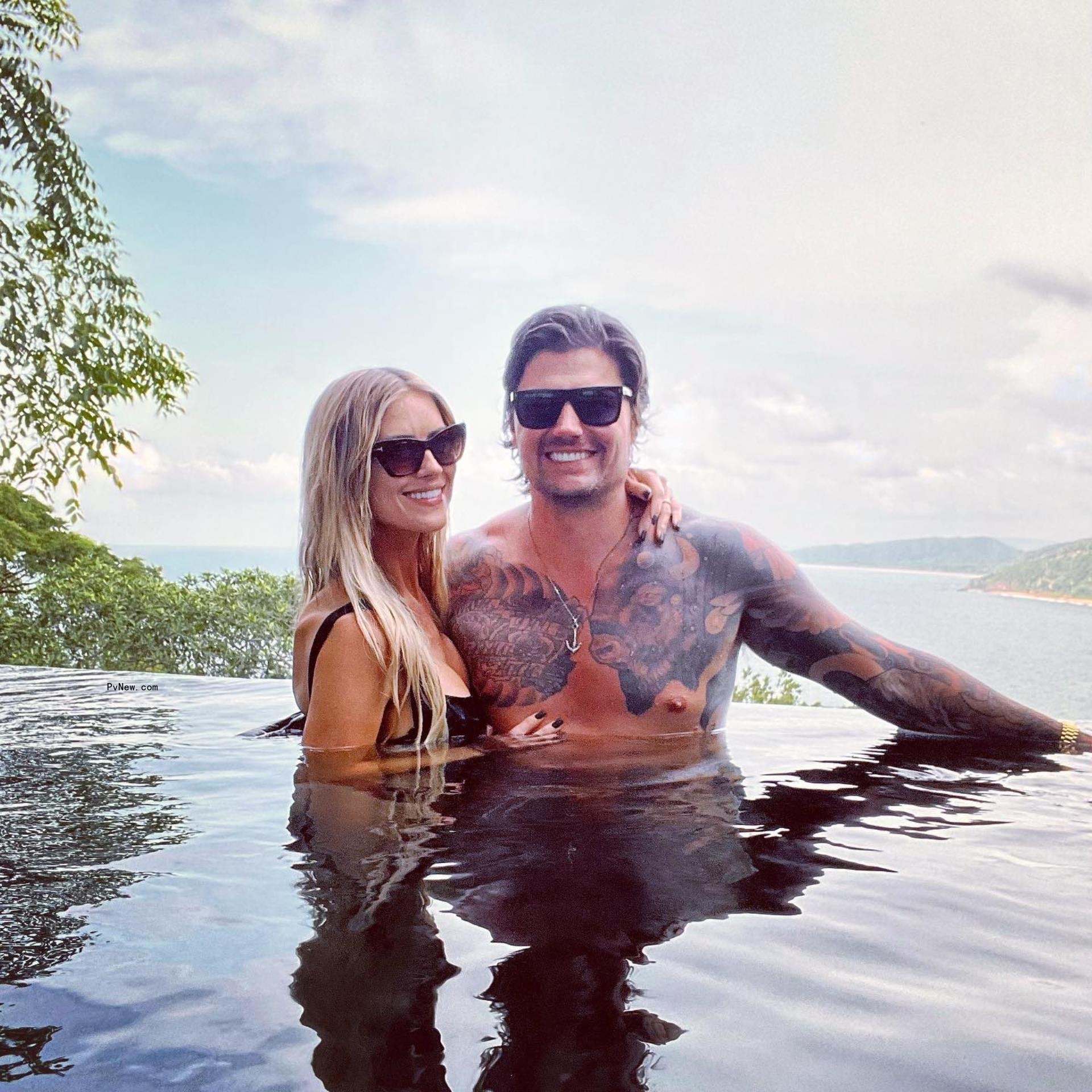 Christina Hall and Josh Hall swimming together.