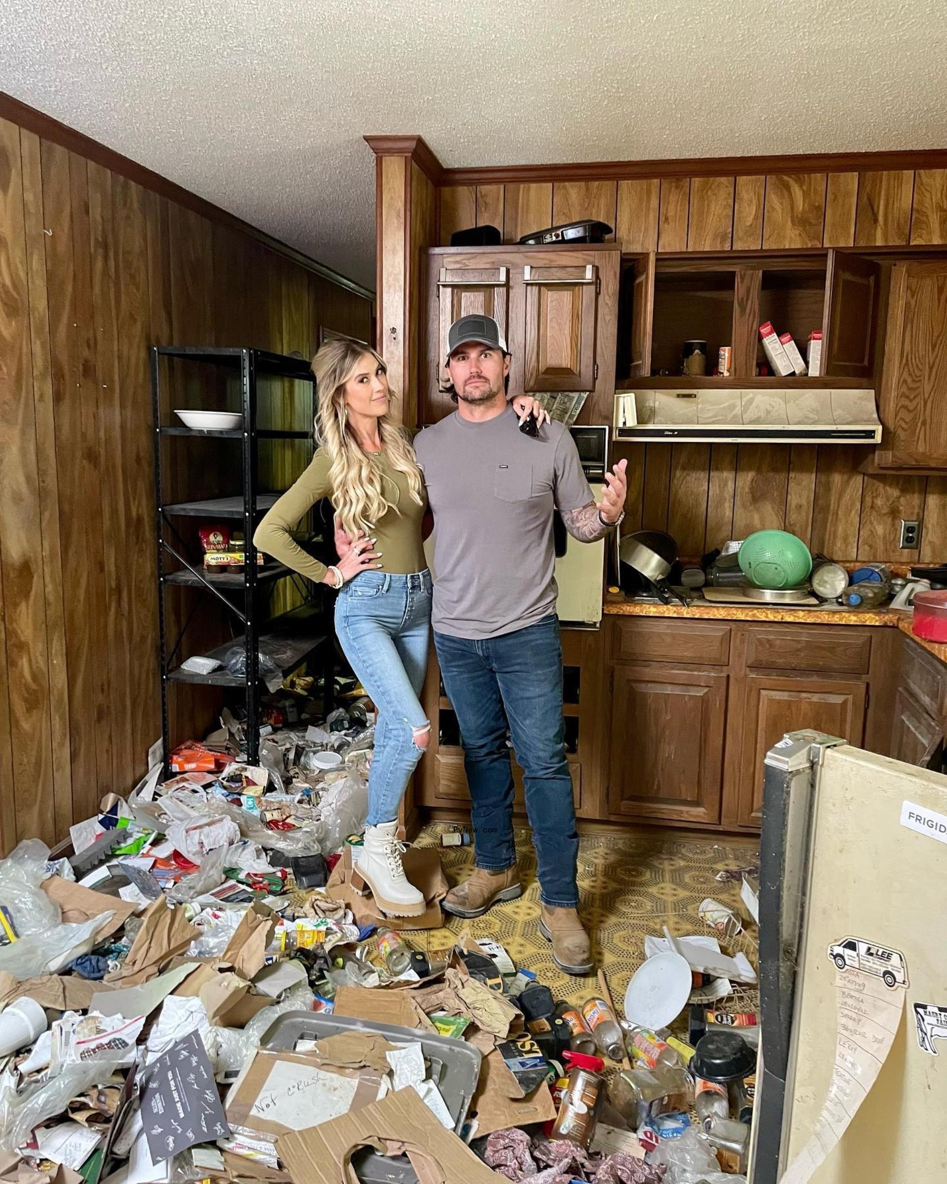 Christina Hall and Josh Hall pose together.