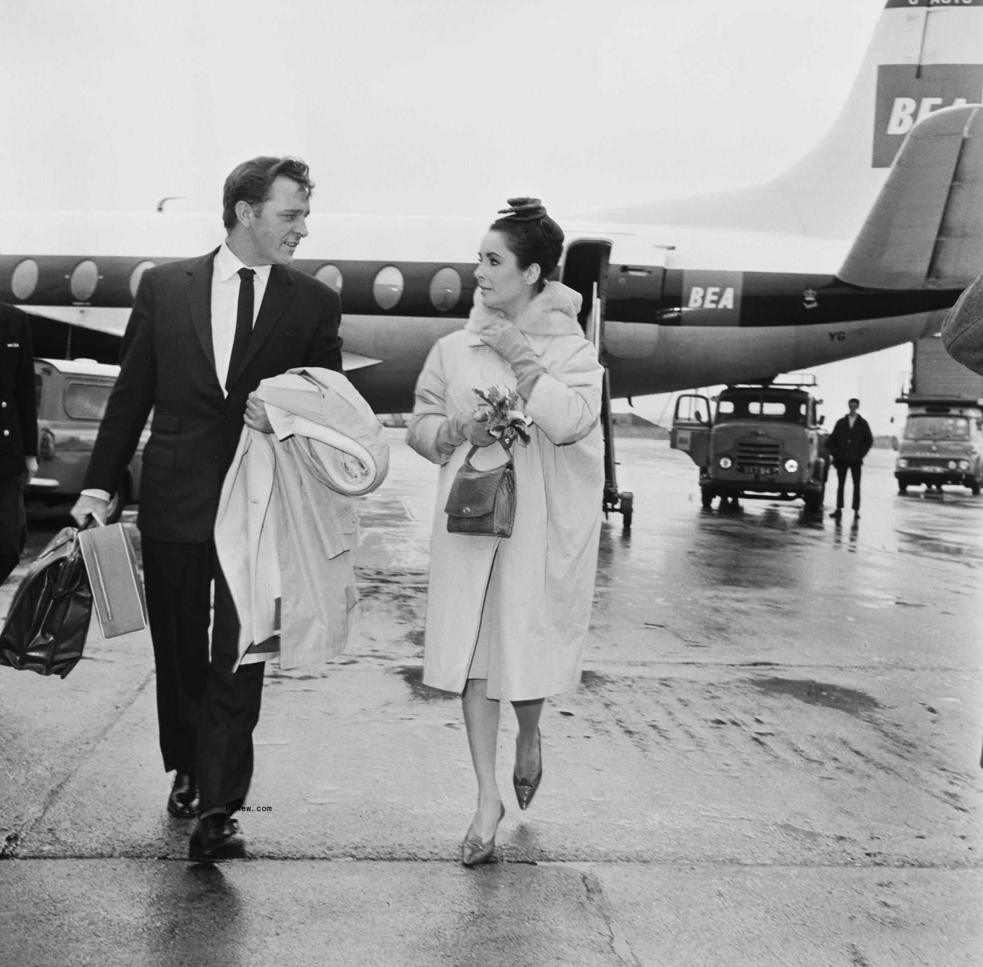 Richard Burton and Elizabeth Taylor arrive at Lo<i></i>ndon Airport (later Heathrow) after a flight from Paris, France, 18th March 1963.