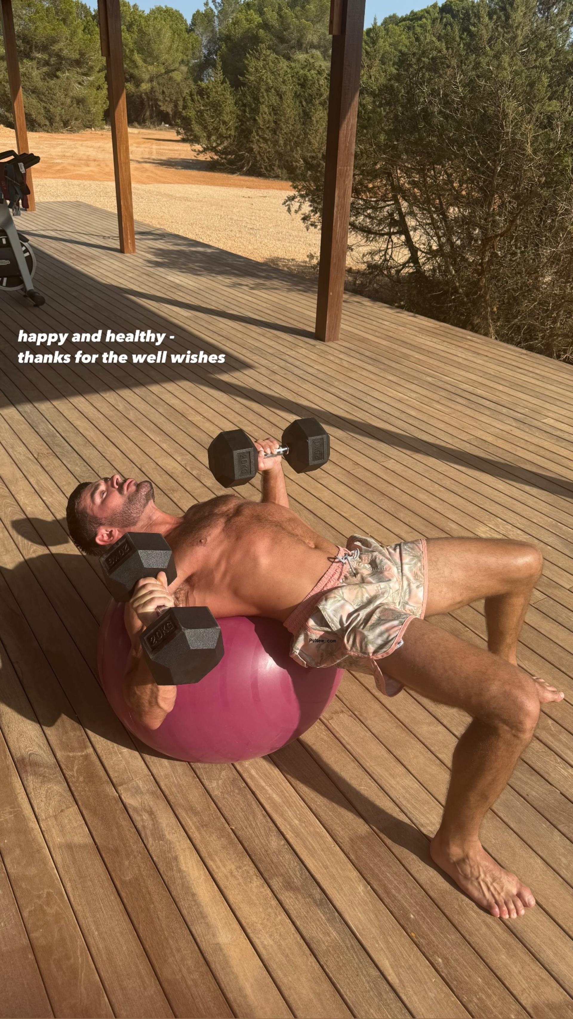 Zac Efron works out on an exercise ball