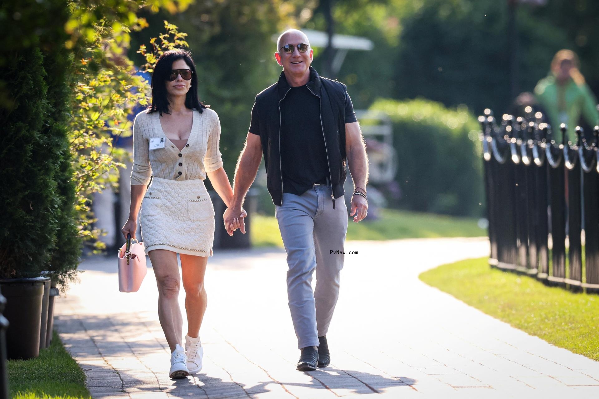 Lauren Sánchez and Jeff Bezos hold hands in Idaho on July 10