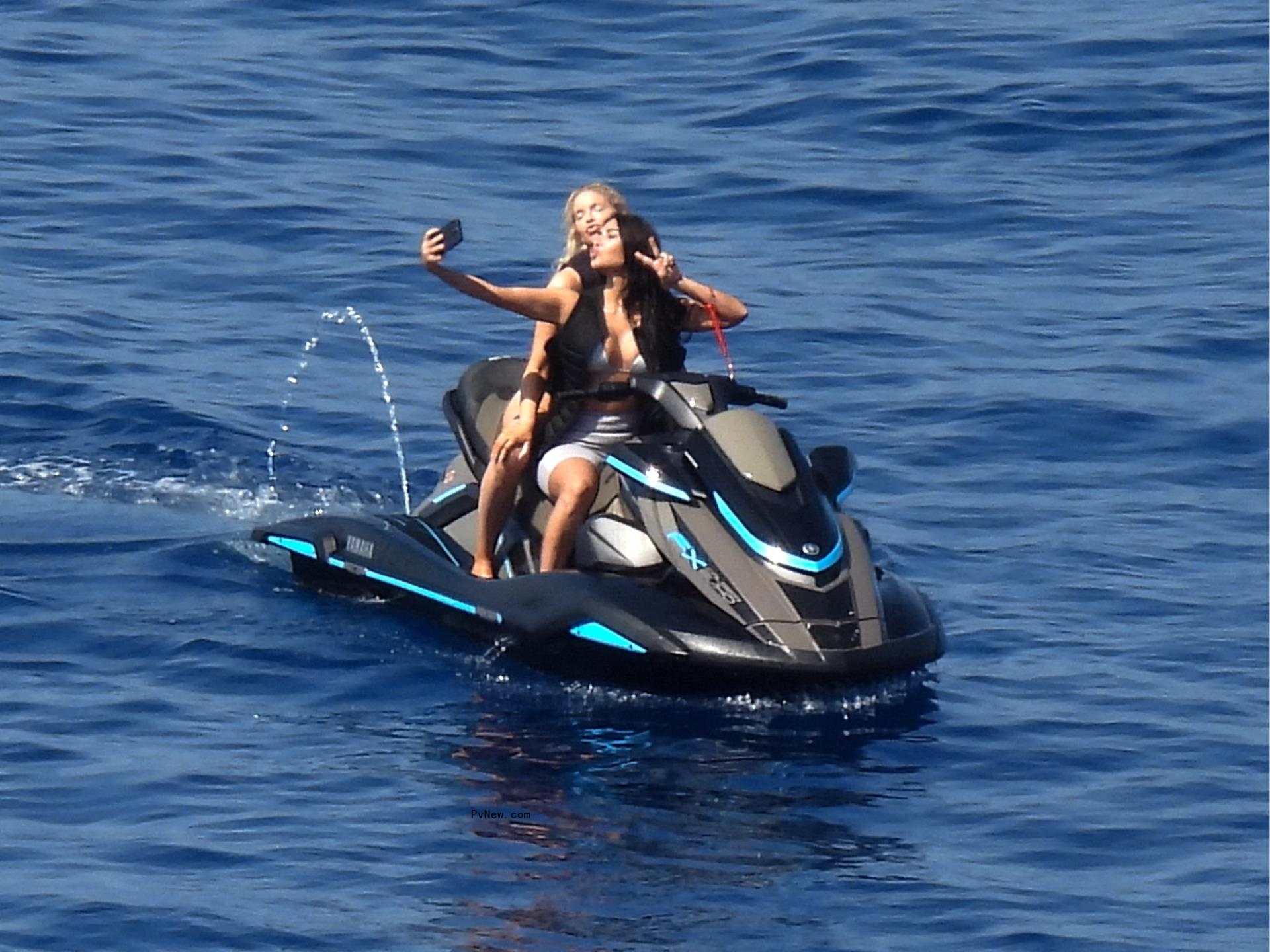 Kim Kardashian snaps a selfie on a jet ski on June 27