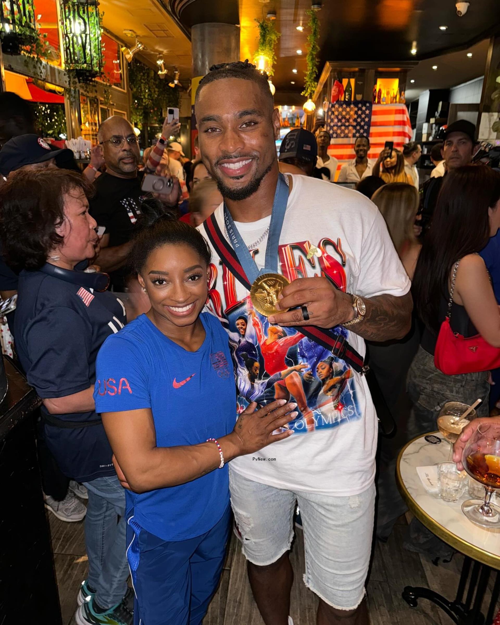 Jo<i></i>nathan Owens and Simone Biles celebrating her gold medal win.