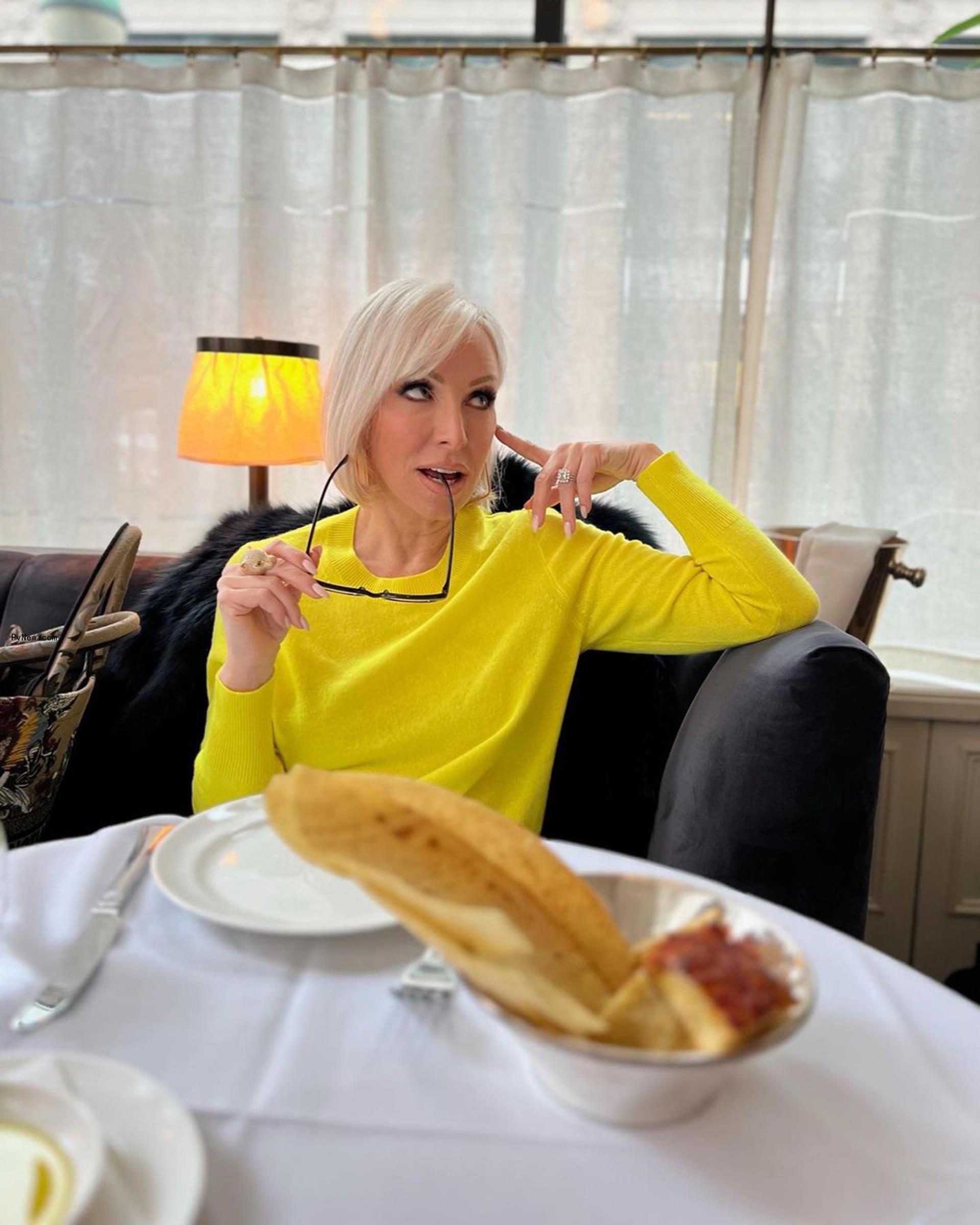 Margaret Josephs sitting at a table