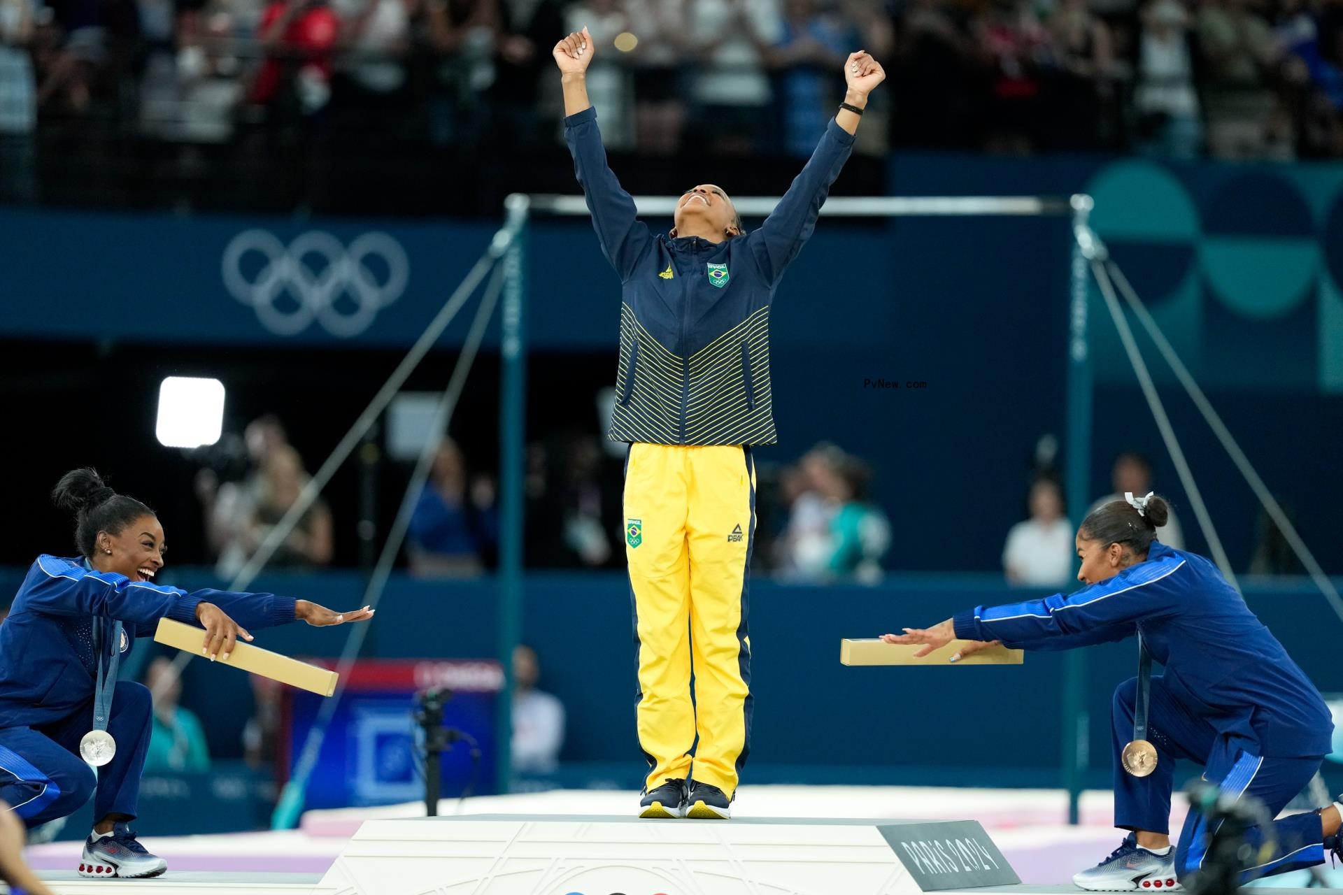 simone biles and jordan chiles bowing down to rebeca andrade at olympics