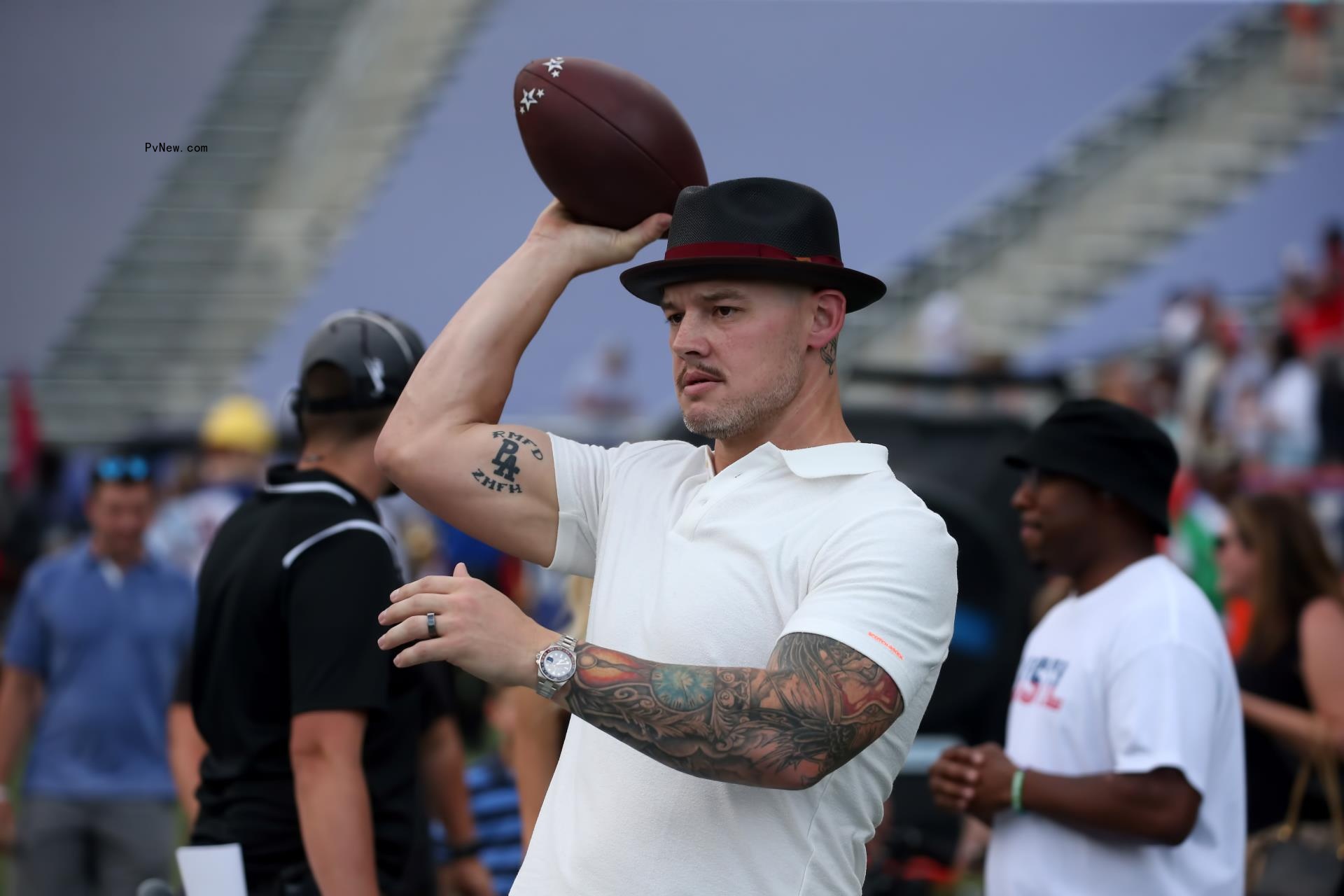 Baron Corbin throws football in June 2022