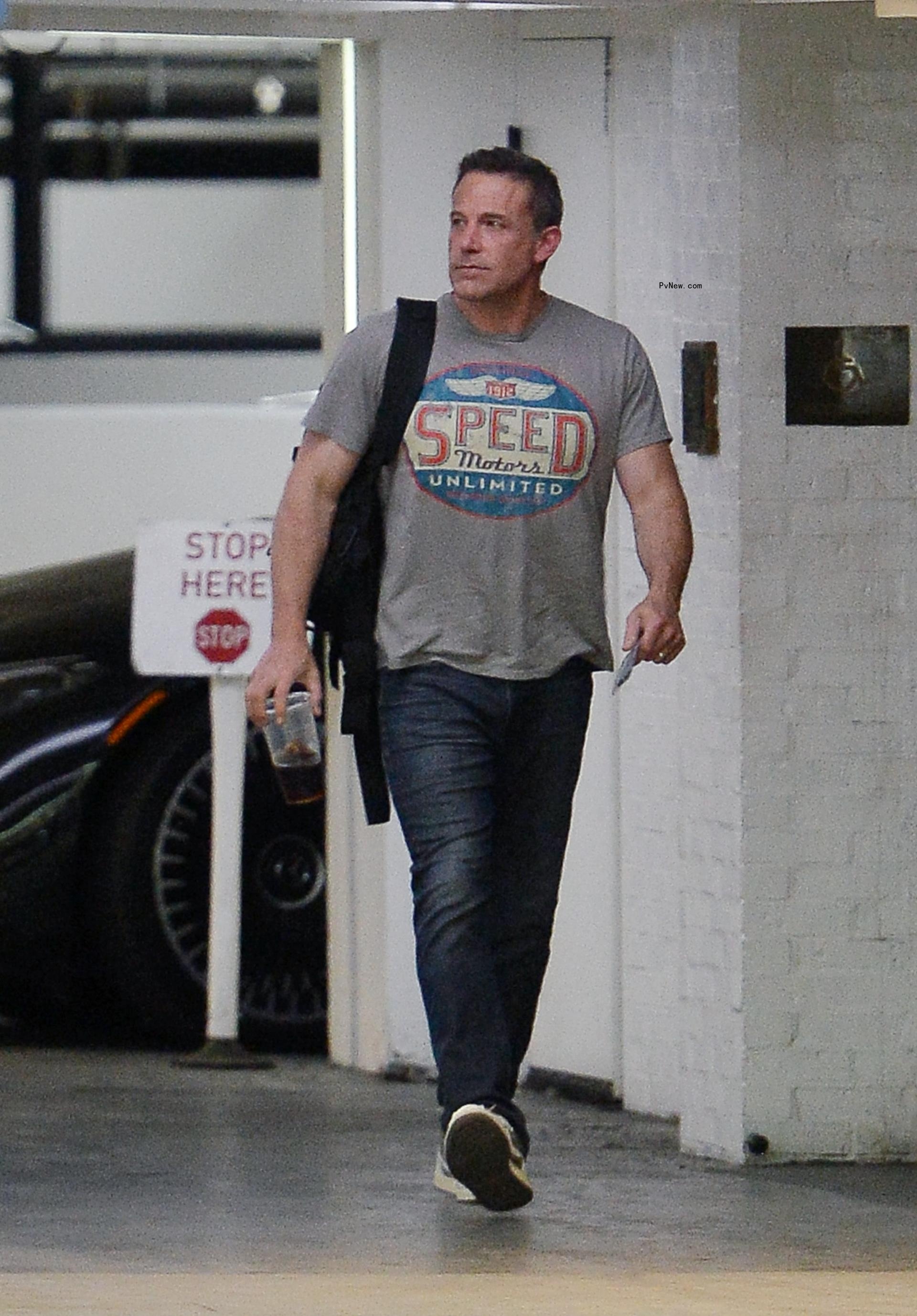 Ben Affleck walks with a coffee on July 7.