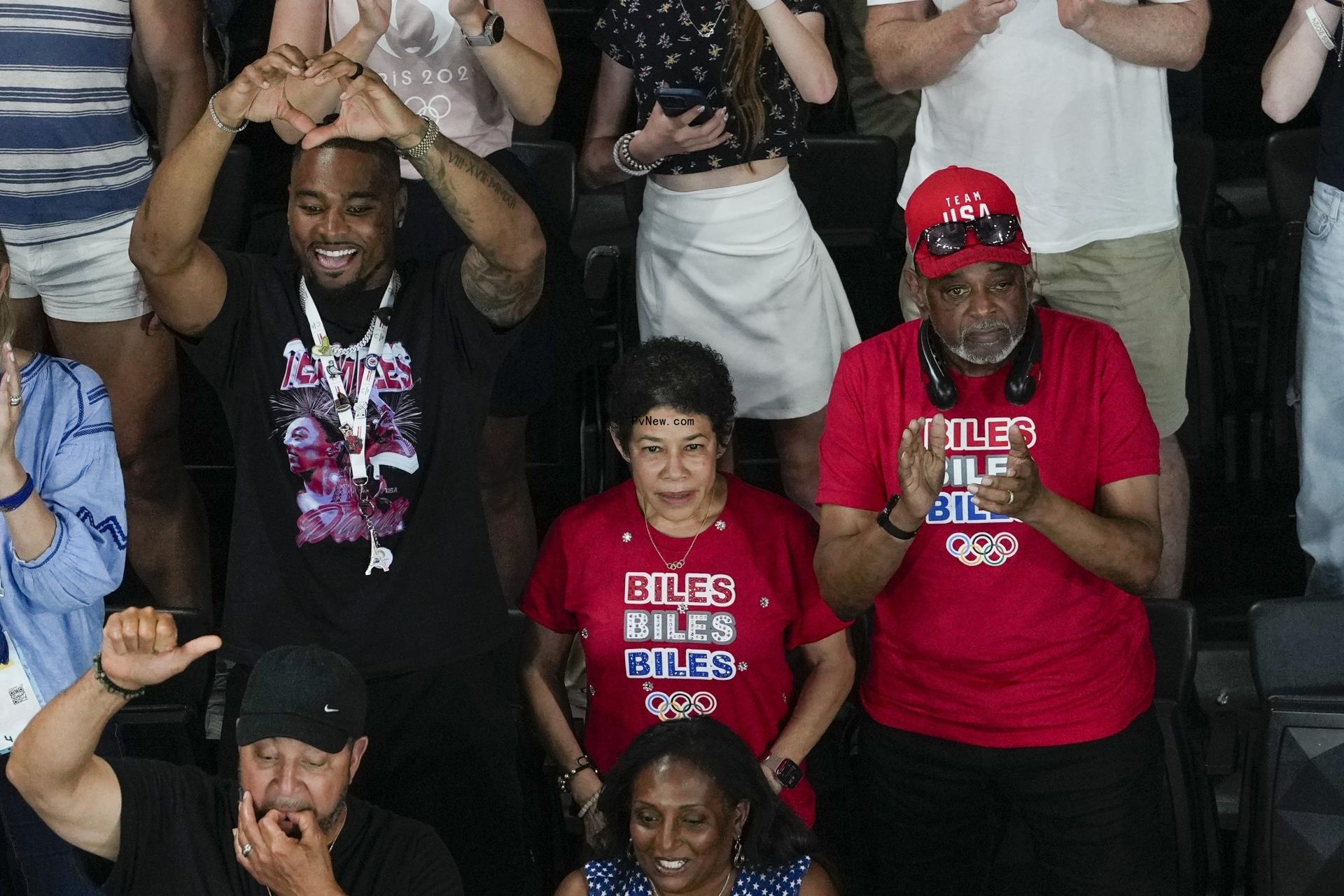 Jo<i></i>nathan Owens at the 2024 Olympics with Simone Biles' parents