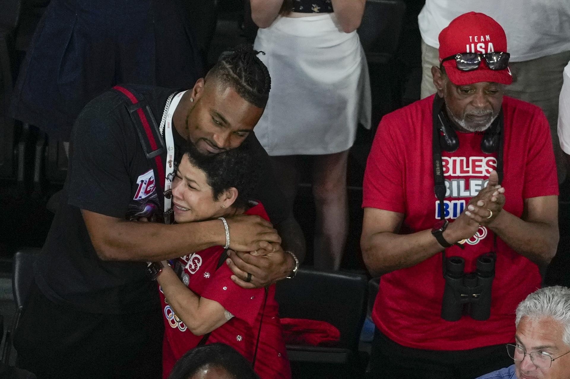 Jo<i></i>nathan Owens at the 2024 Olympics with Simone Biles' parents