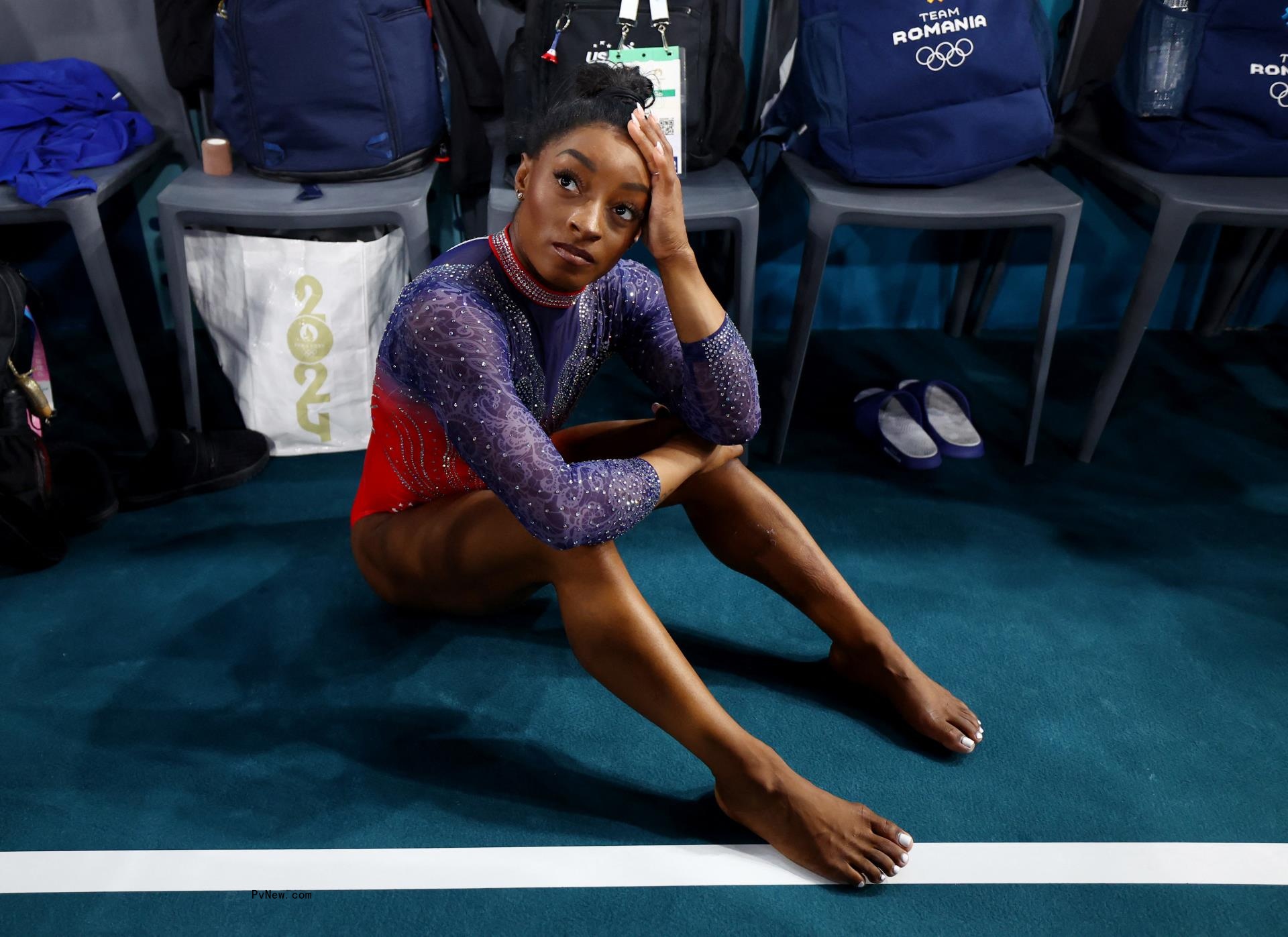 Simone Biles thinking.