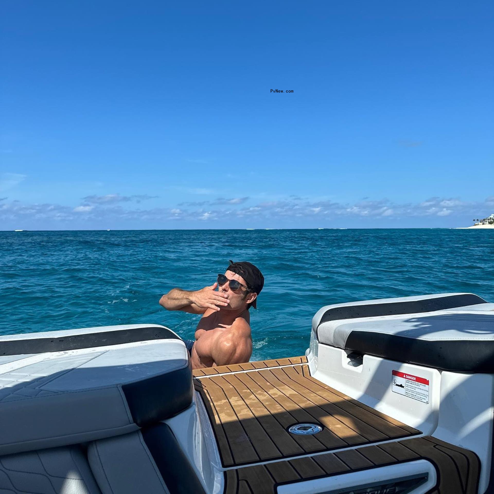 Zac Efron swimming.