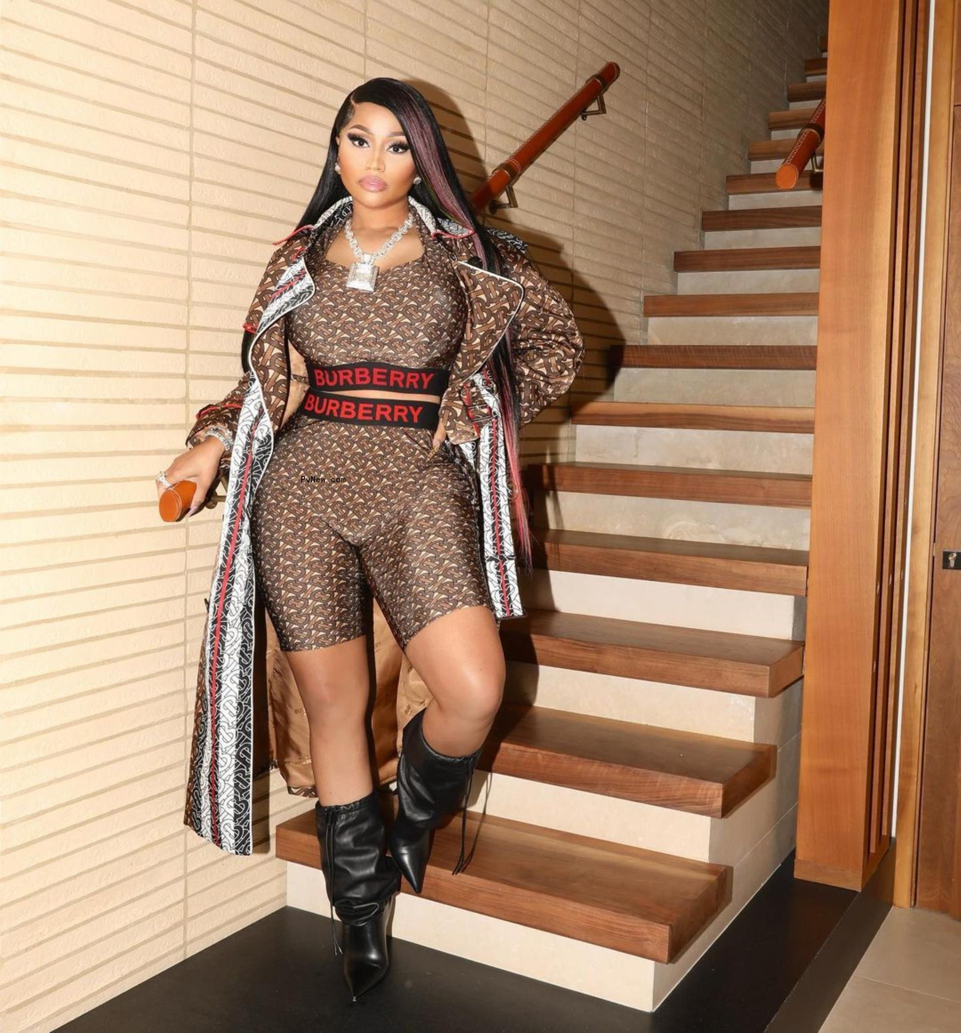Nicki Minaj standing on the stairs.