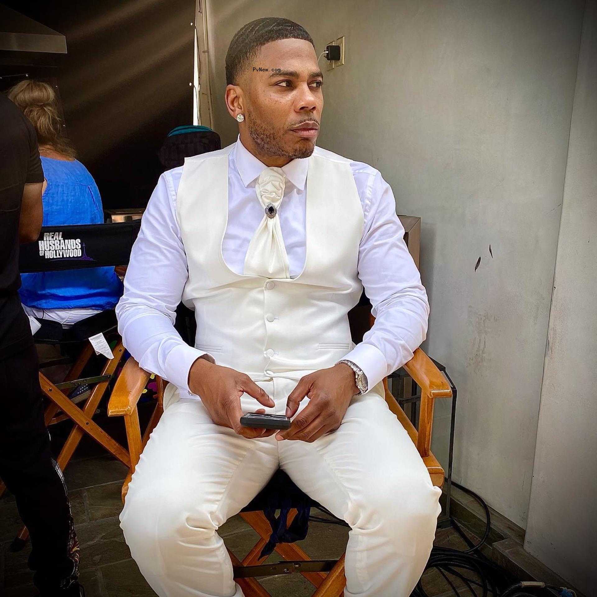 Nelly in a suit.