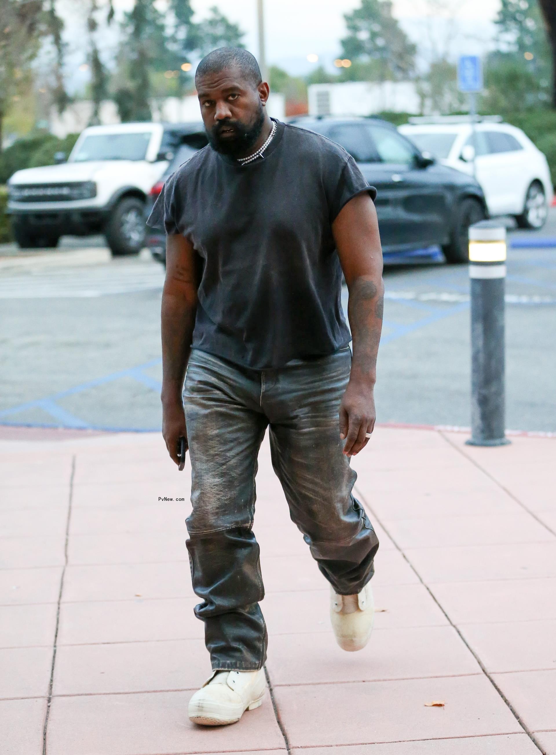 Kanye West walking.