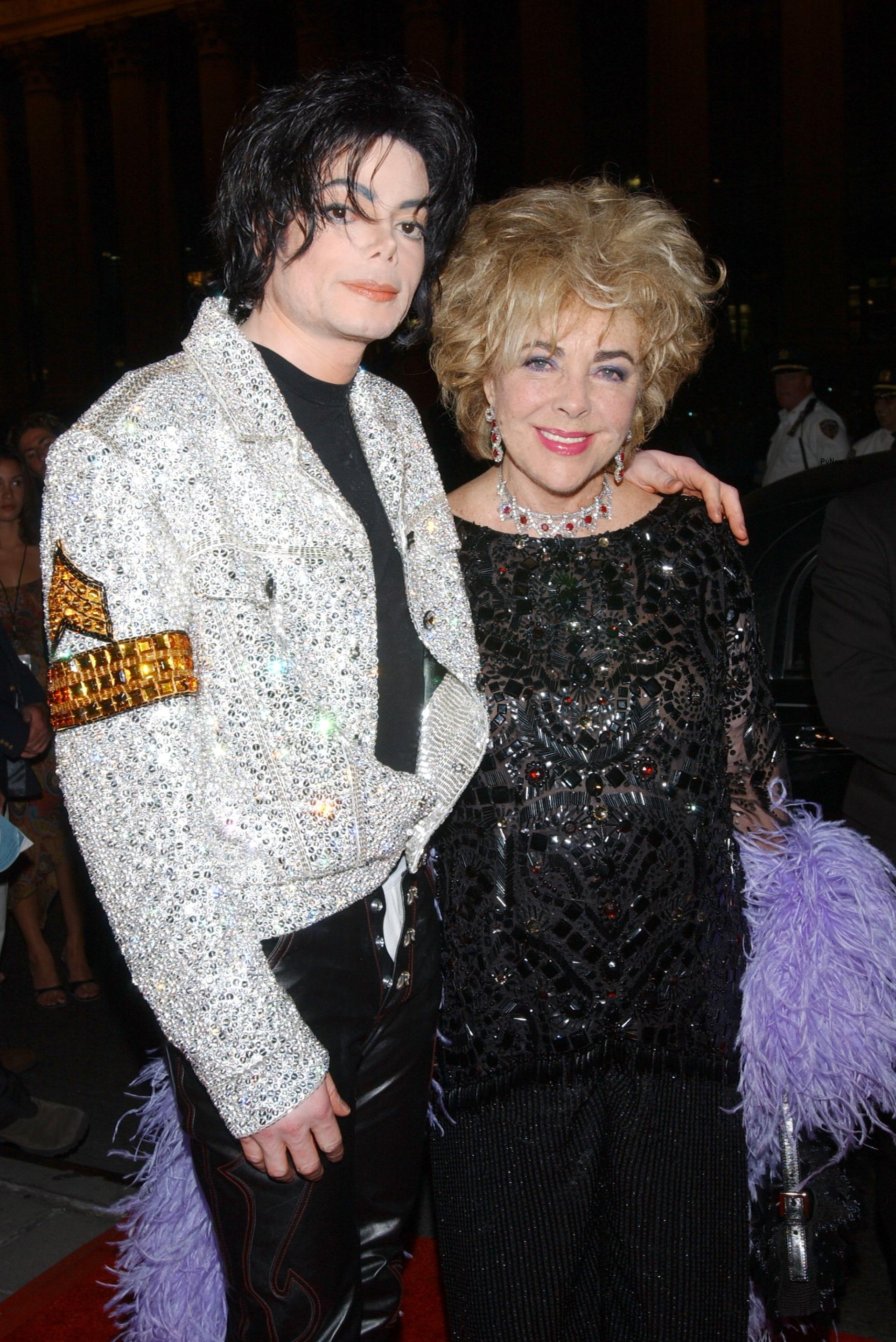 Michael Jackson and Elizabeth Taylor wearing a ruby Cartier necklace given to her by Mike Todd