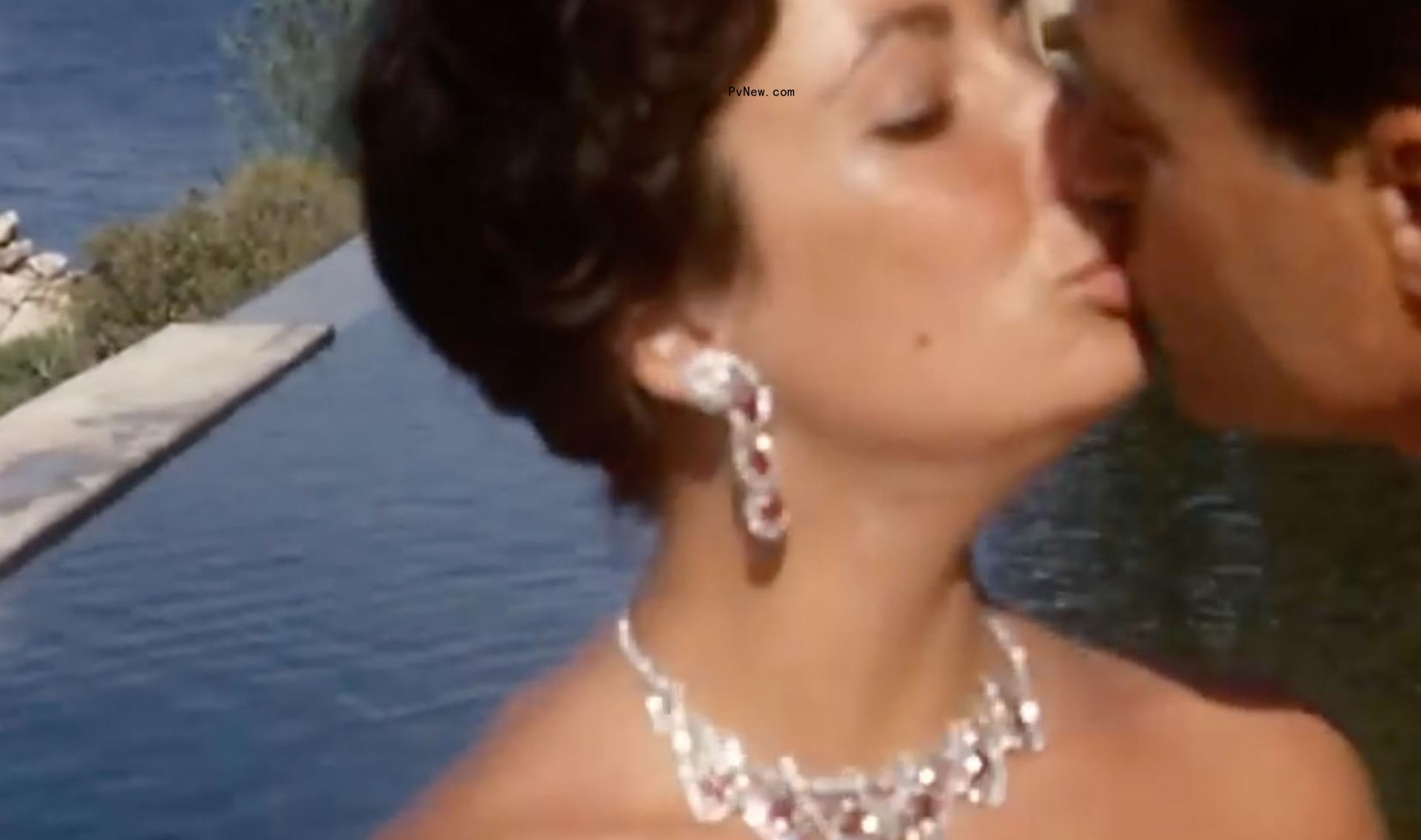 Elizabeth Taylor wearing a ruby Cartier necklace given to her by Mike Todd