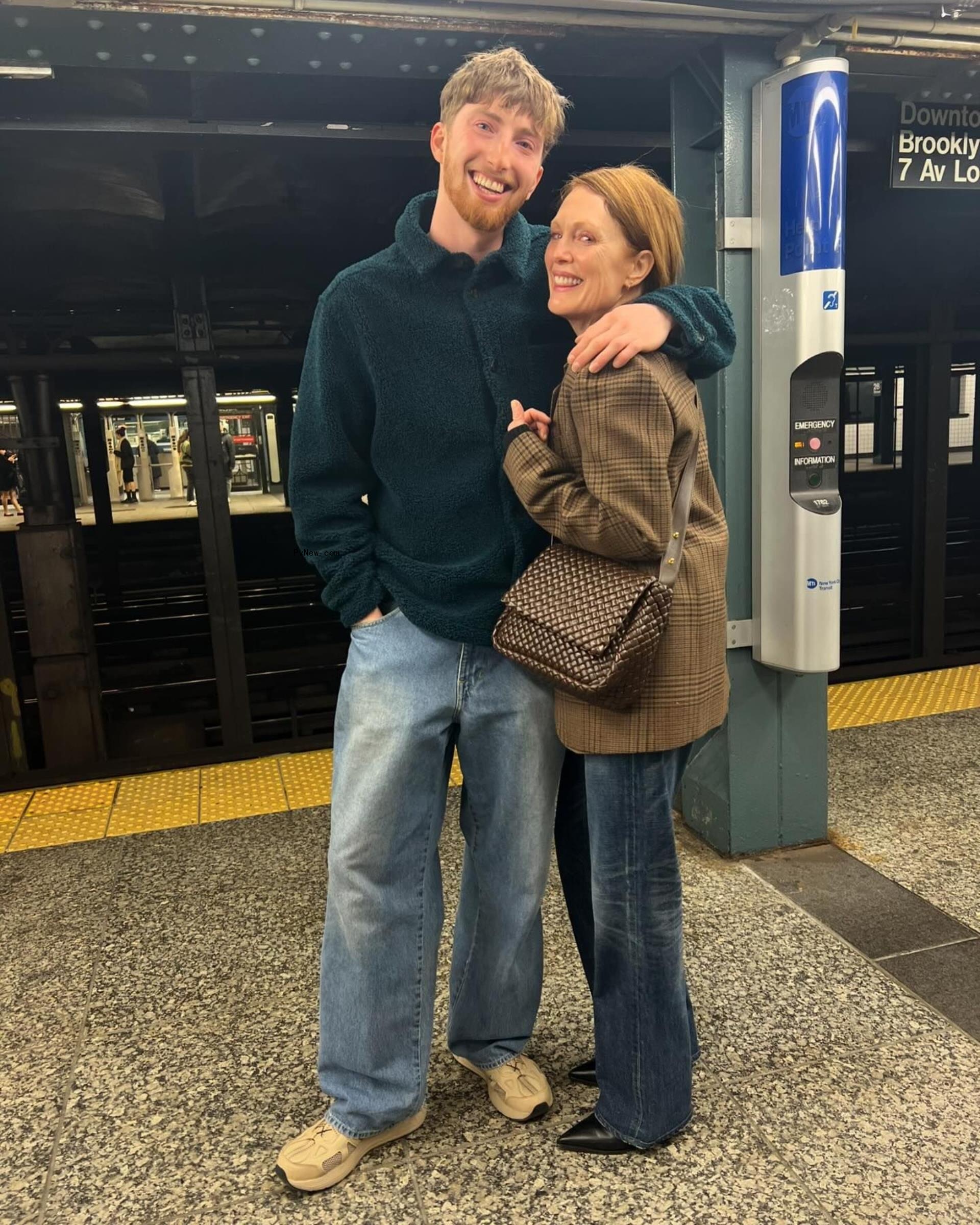 julianne moore's son caleb wrapping his arm around her on a subway platform