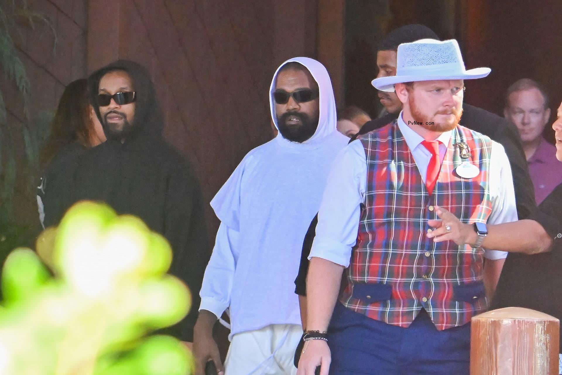 Kanye West walking in Disneyland
