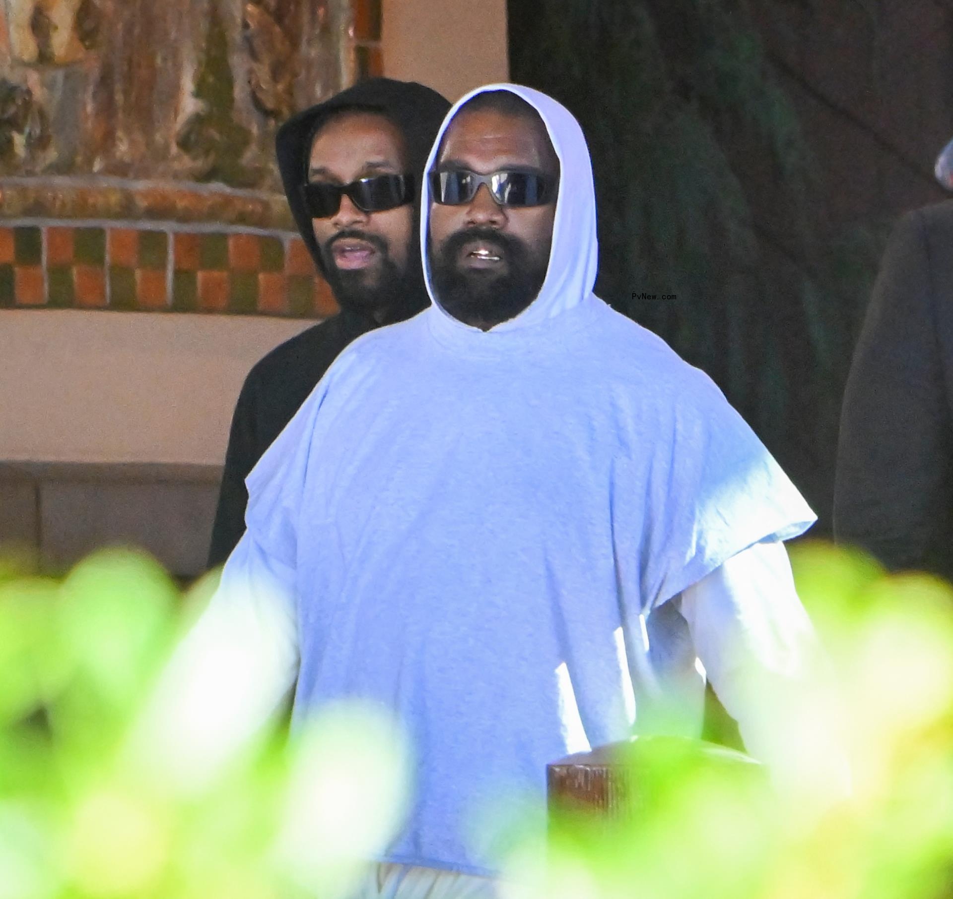 Kanye West walking though Disneyland