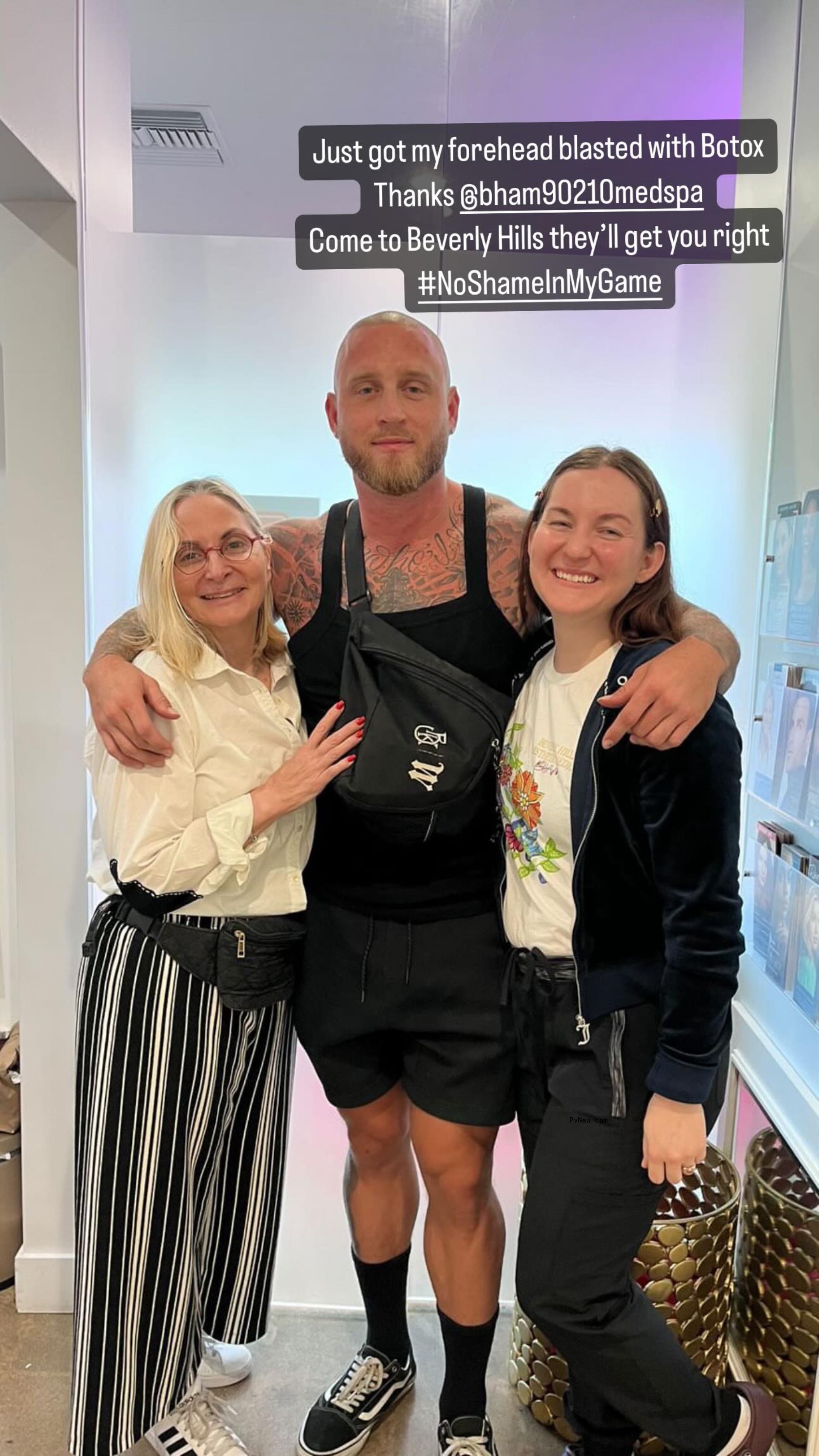 chet hanks standing in the middle of two women with his arms wrapped around them