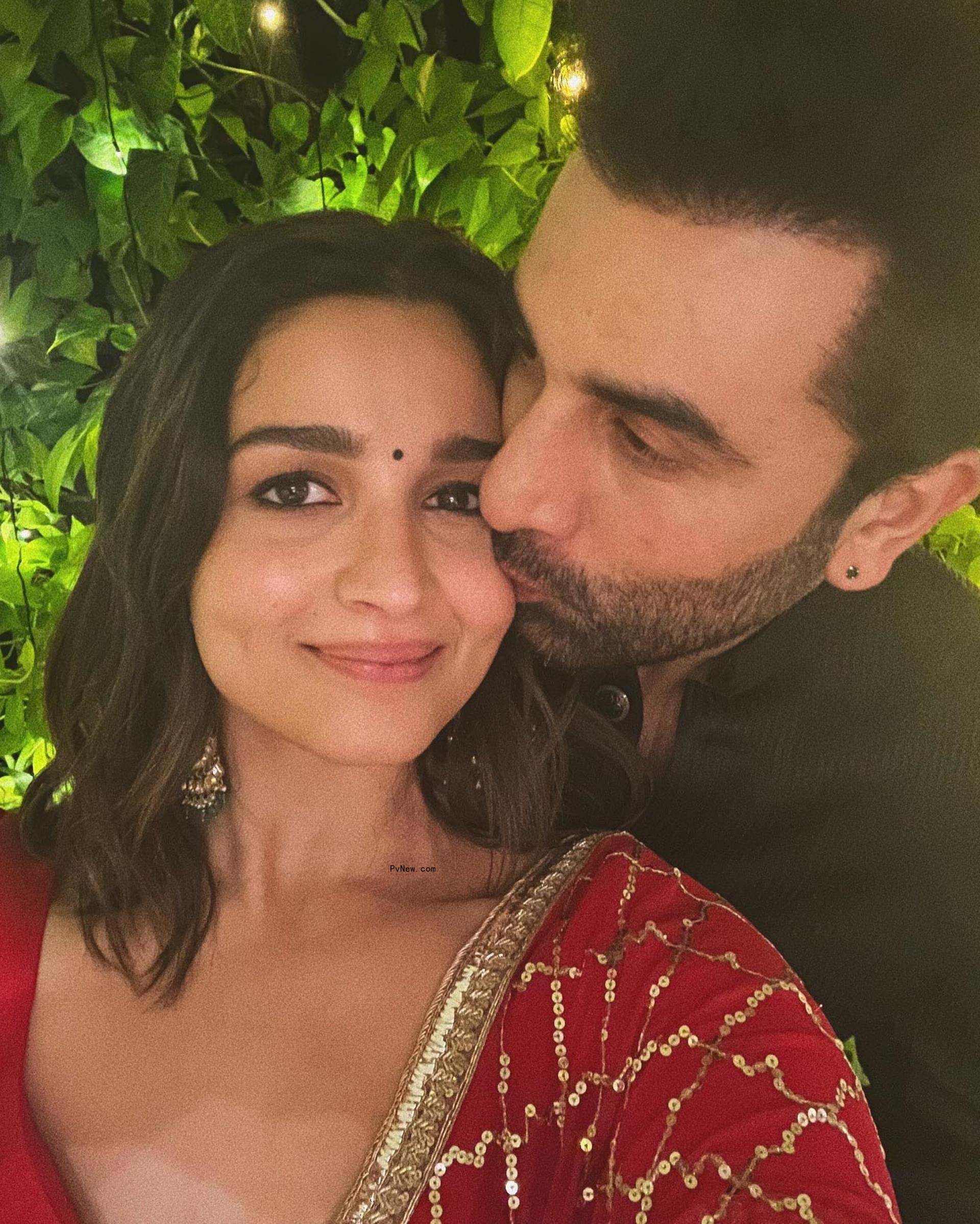 Ranbir Kapoor kissing Alia Bhatt on the cheek in a selfie.