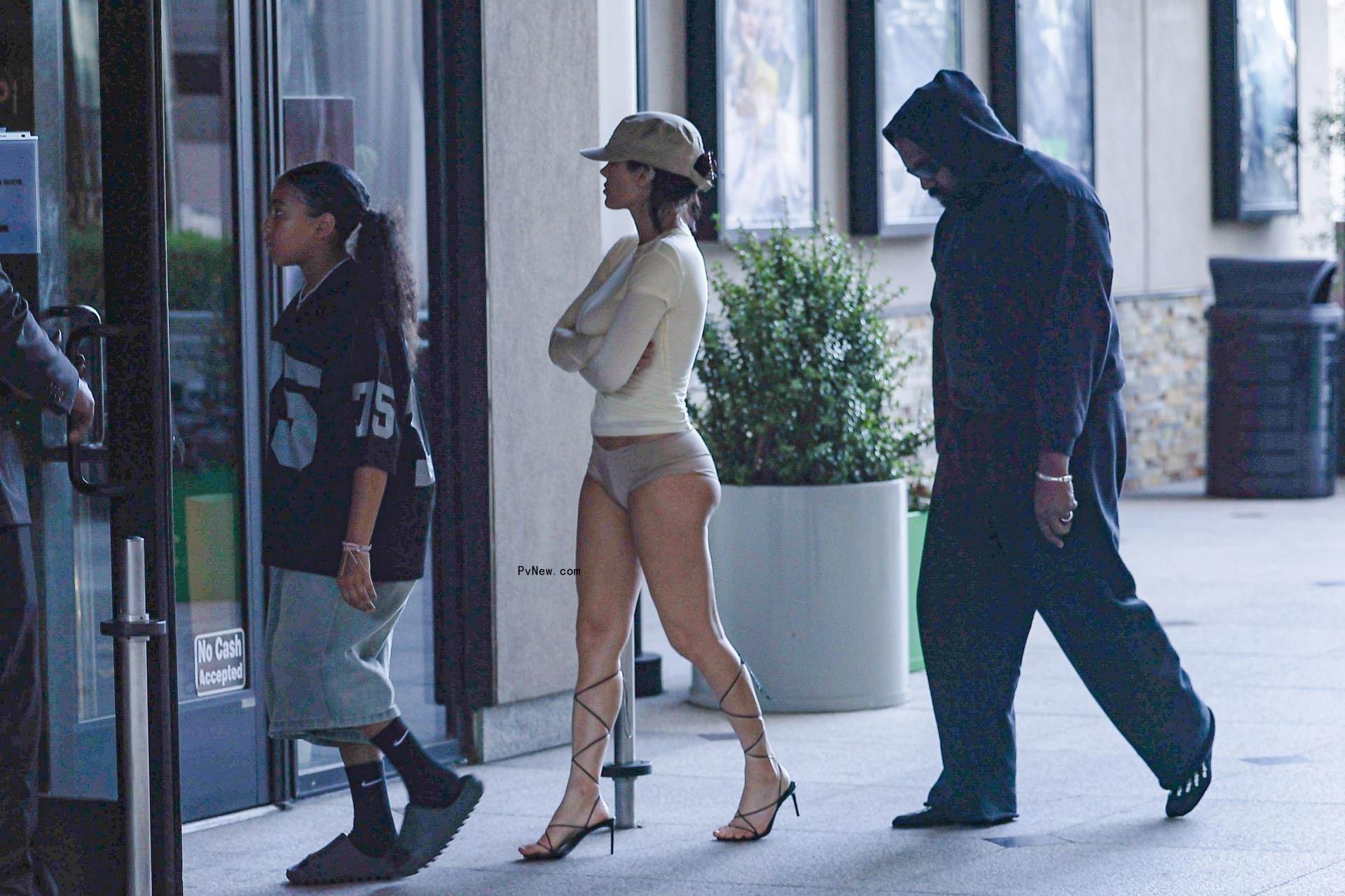 Rapper Kanye West, wife Bianca Censori and daughter North West watch