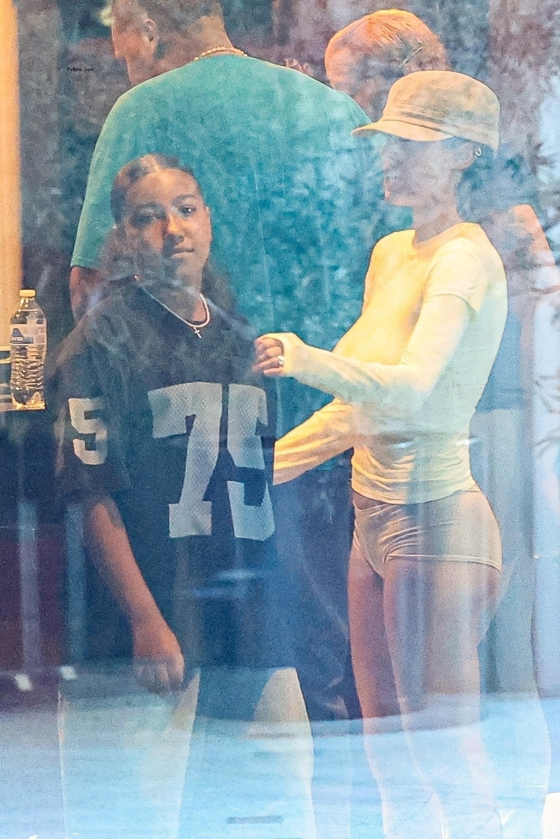 Bianca Censori and North West at a movie theater in Los Angeles