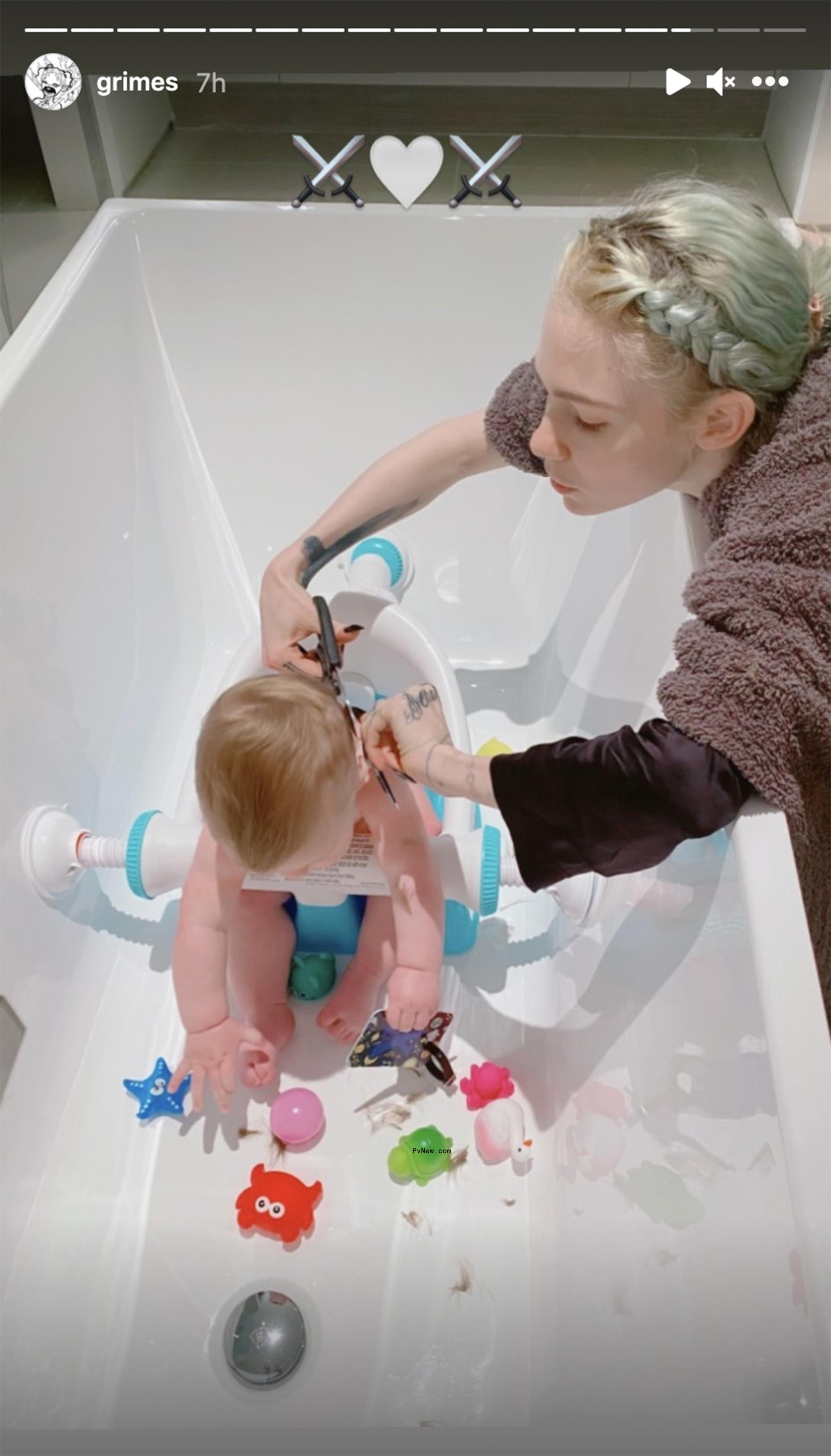 Grimes cutting her child's hair in the bathtub.