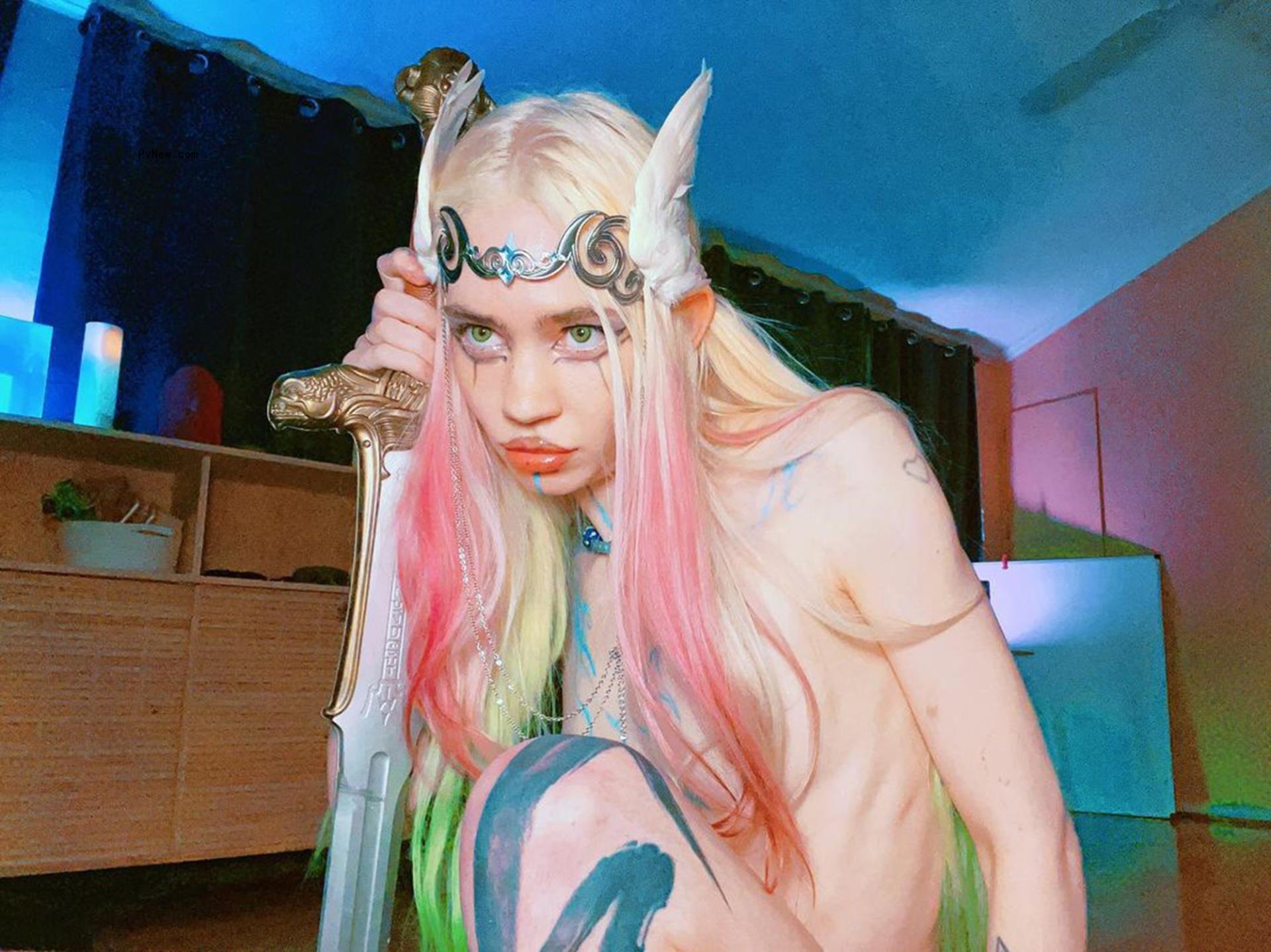 Grimes posing with a sword.