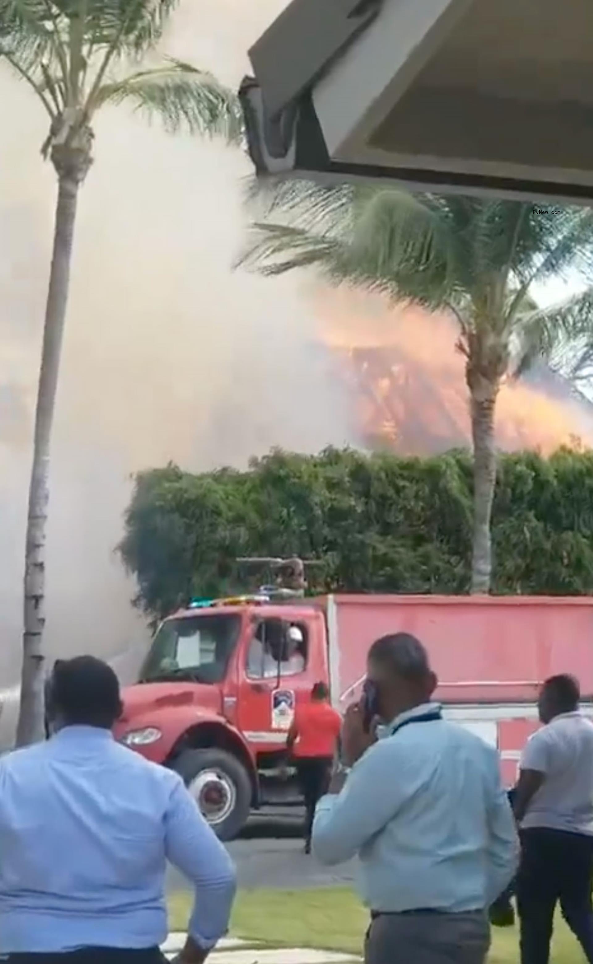 Firefighters putting out a fire at Marc Anthony's home in the Dominican Republic.