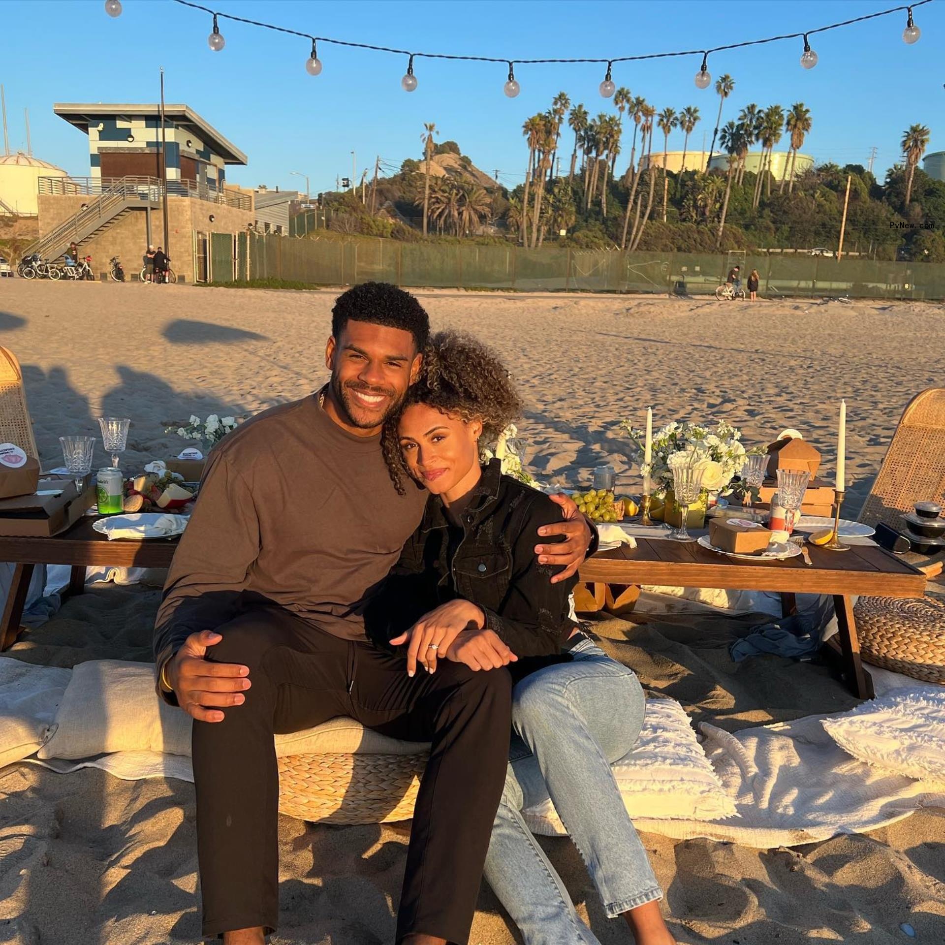 Sydney McLaughlin and Andre Levrone  at the beach