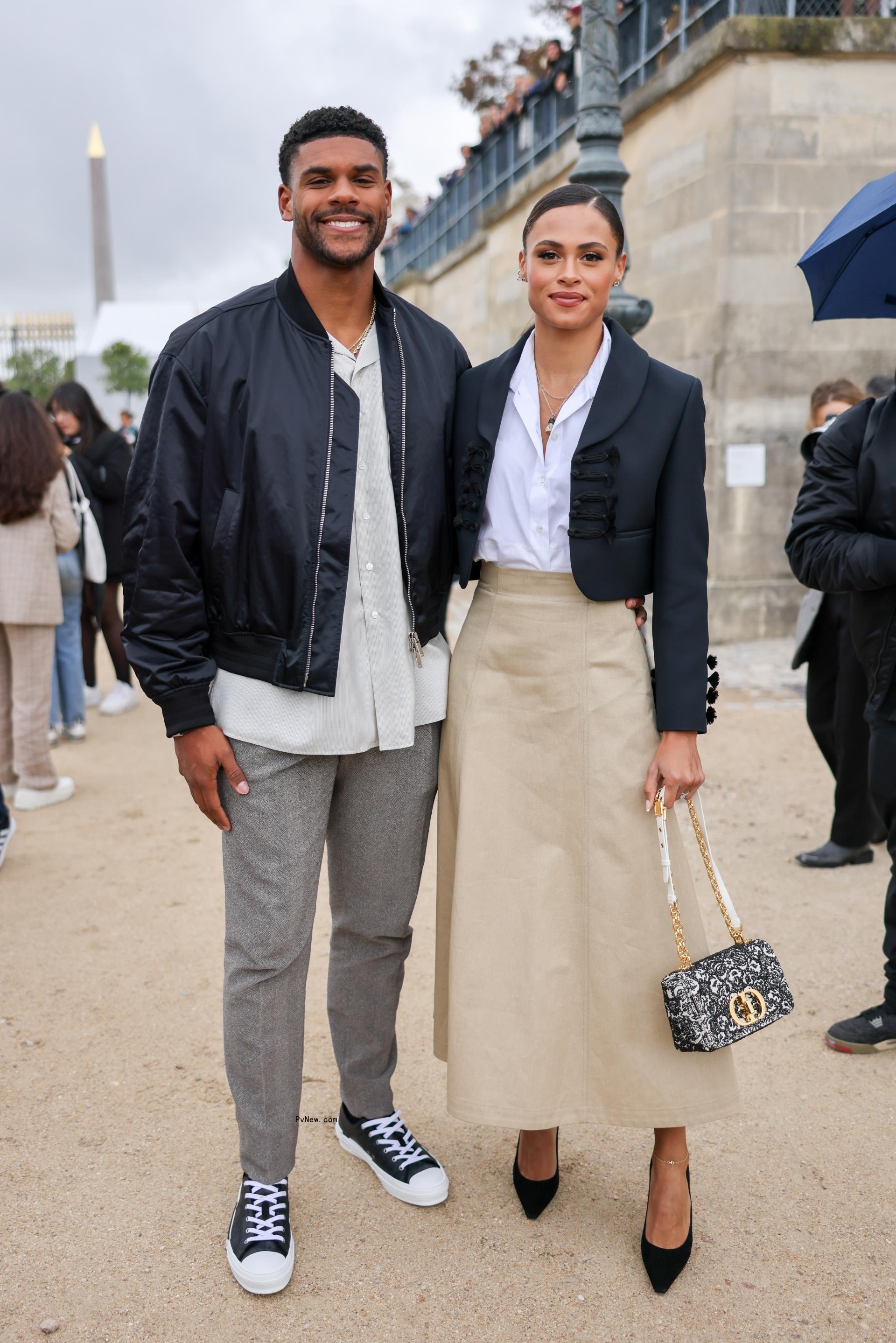 Sydney McLaughlin and Andre Levrone at fashion week.