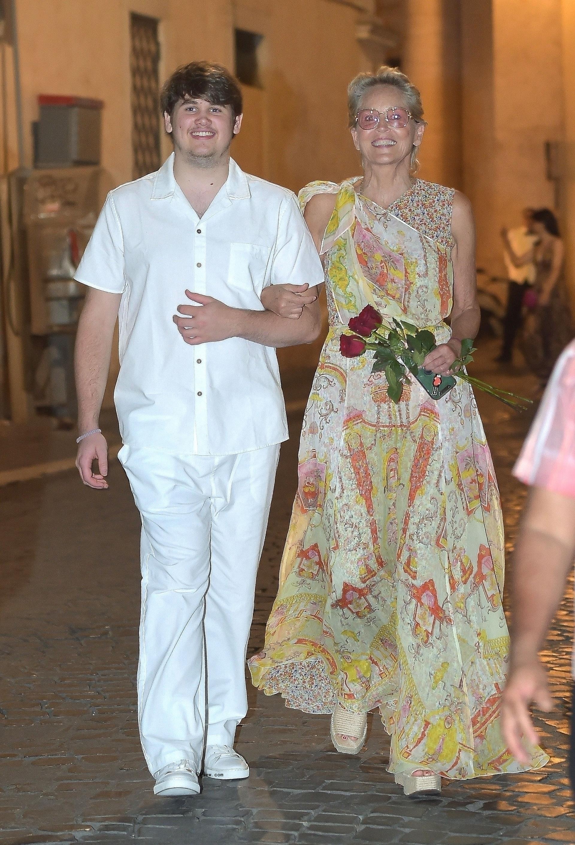 Sharon Stone looks thrilled while dining at Dal Bolognese in Rome, Italy, in July 2024.