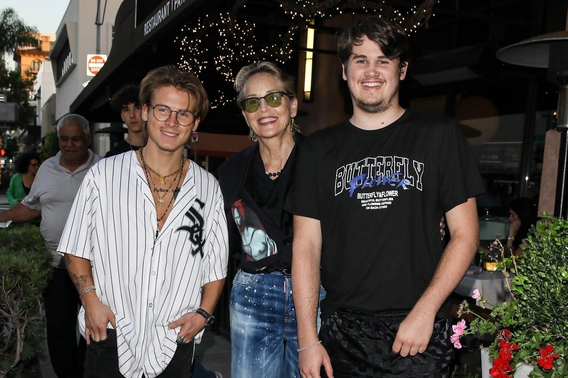 Sharon Stone poses for a picture with her two sons Roan and Laird after lunch at Via Alloro Italian restaurant in Beverly Hills.