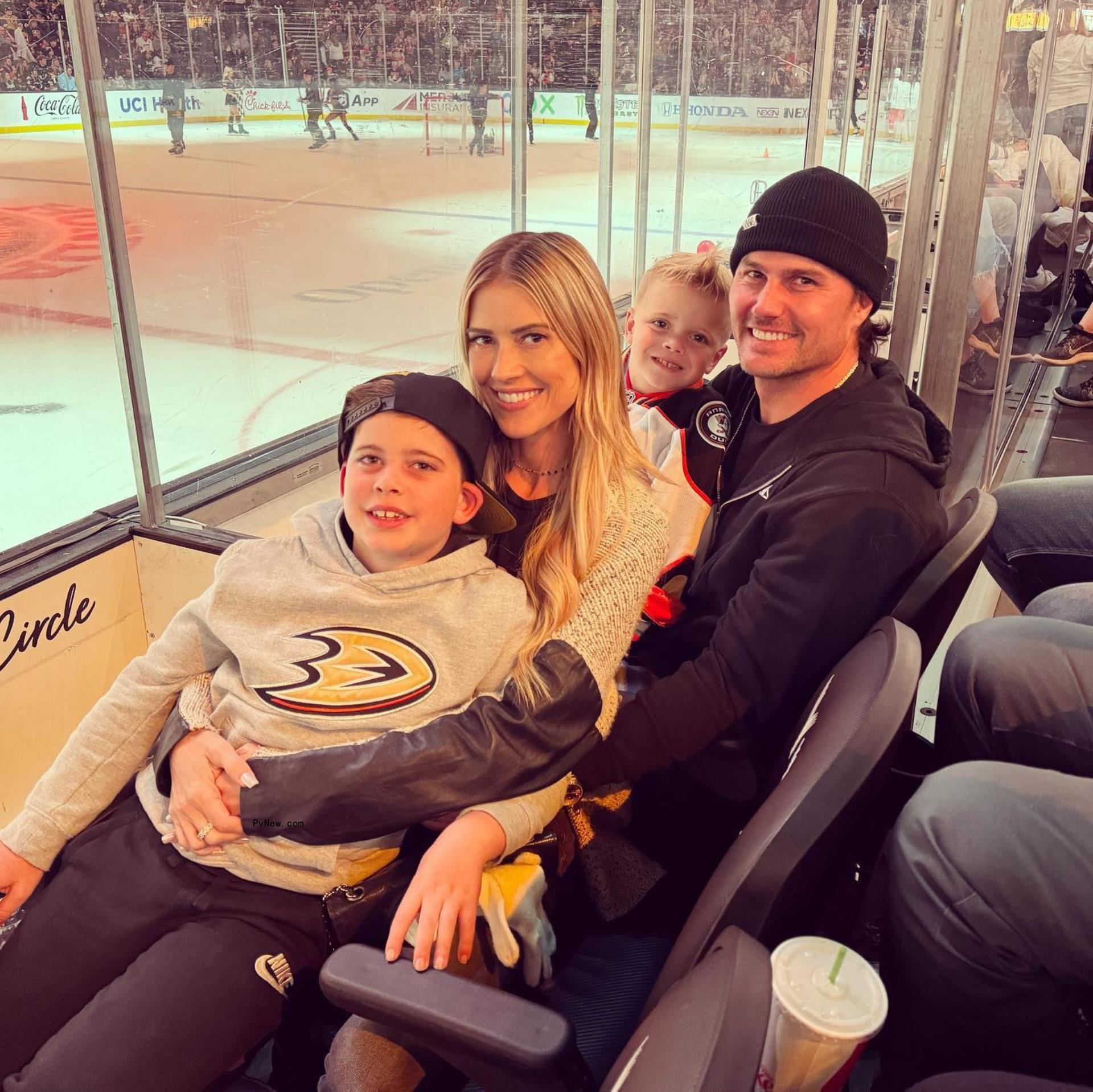 Christina Hall, Josh Hall and her sons at a hockey game.