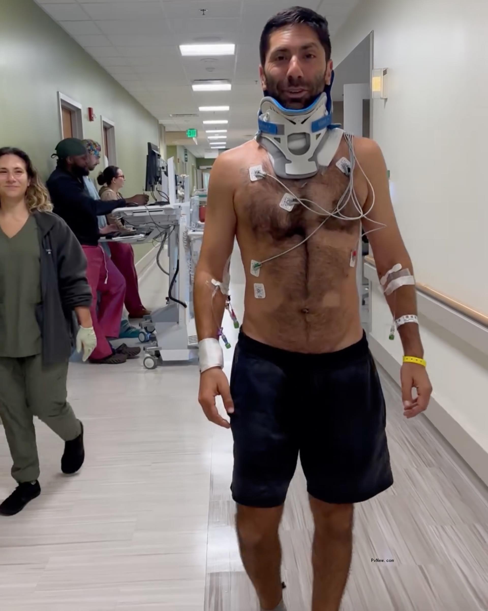 Nev Schulman walking in the hospital.