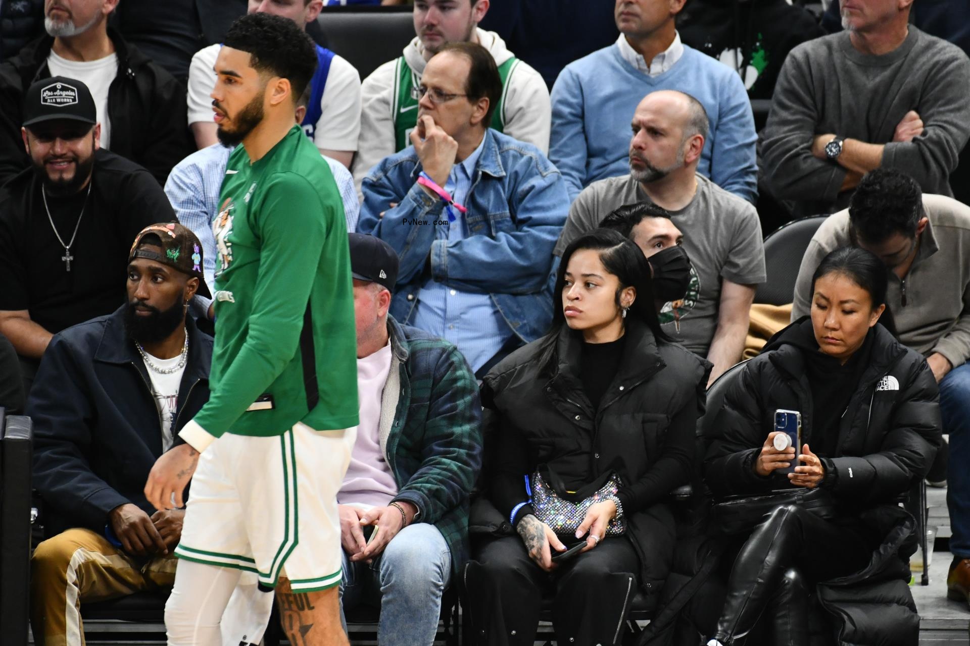 Ella Mai watching Jayson Tatum play basketball in December 2022.