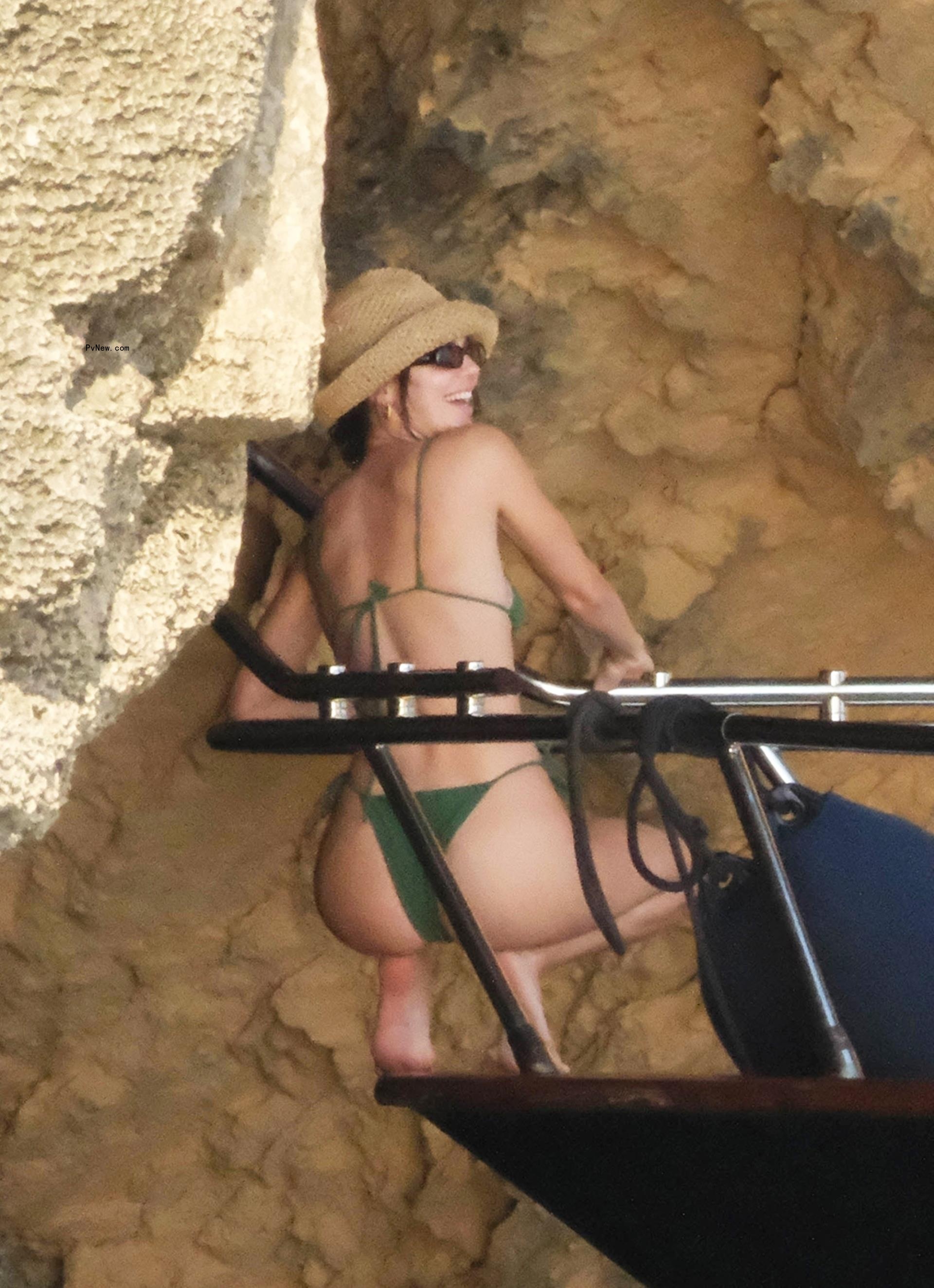 Kendall Jenner in a green bikini on a boat in Ibiza