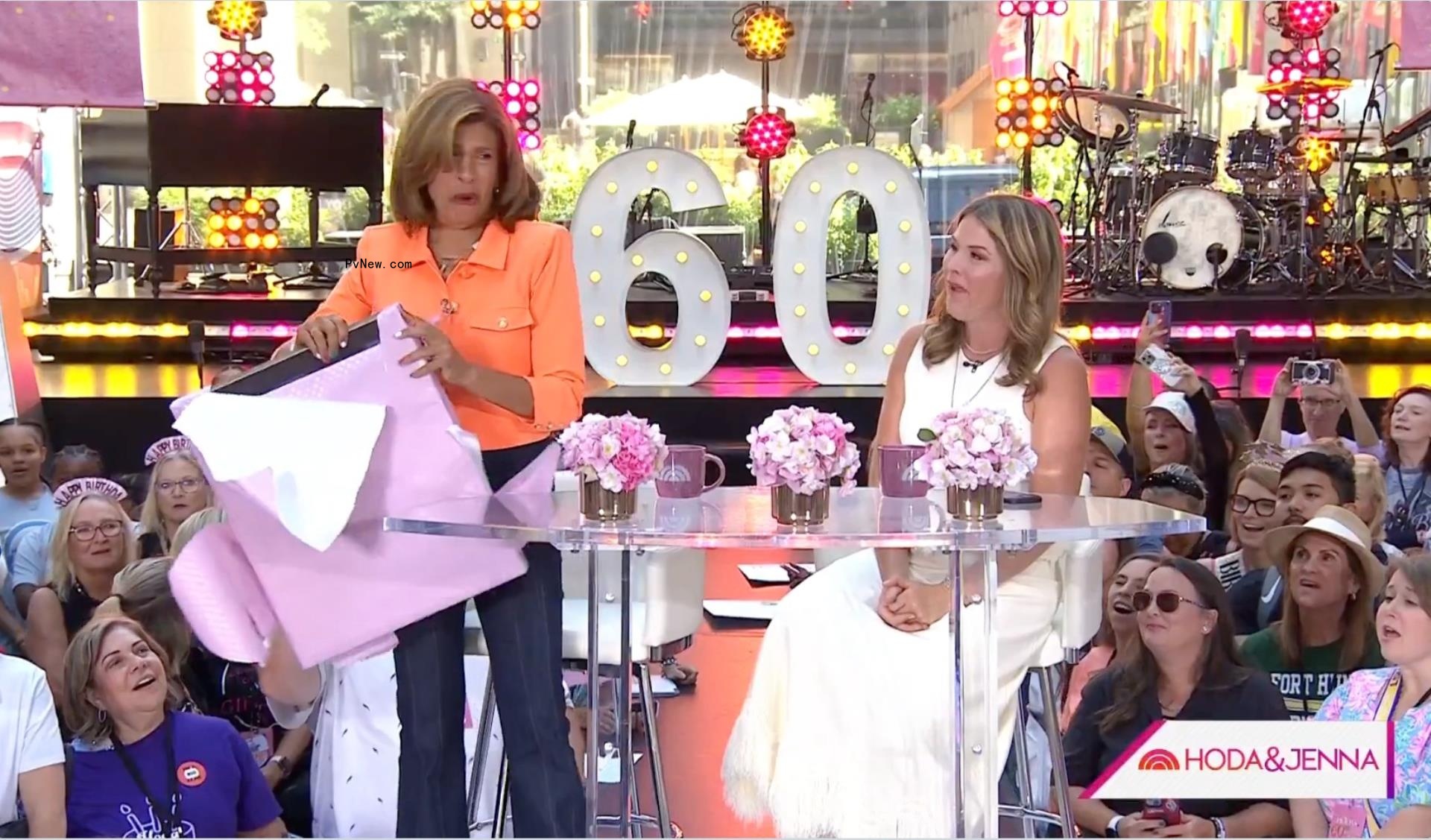 Hoda Kotb opens a portrait gifted to her by Jenna Bush Hager on Monday's episode of the 