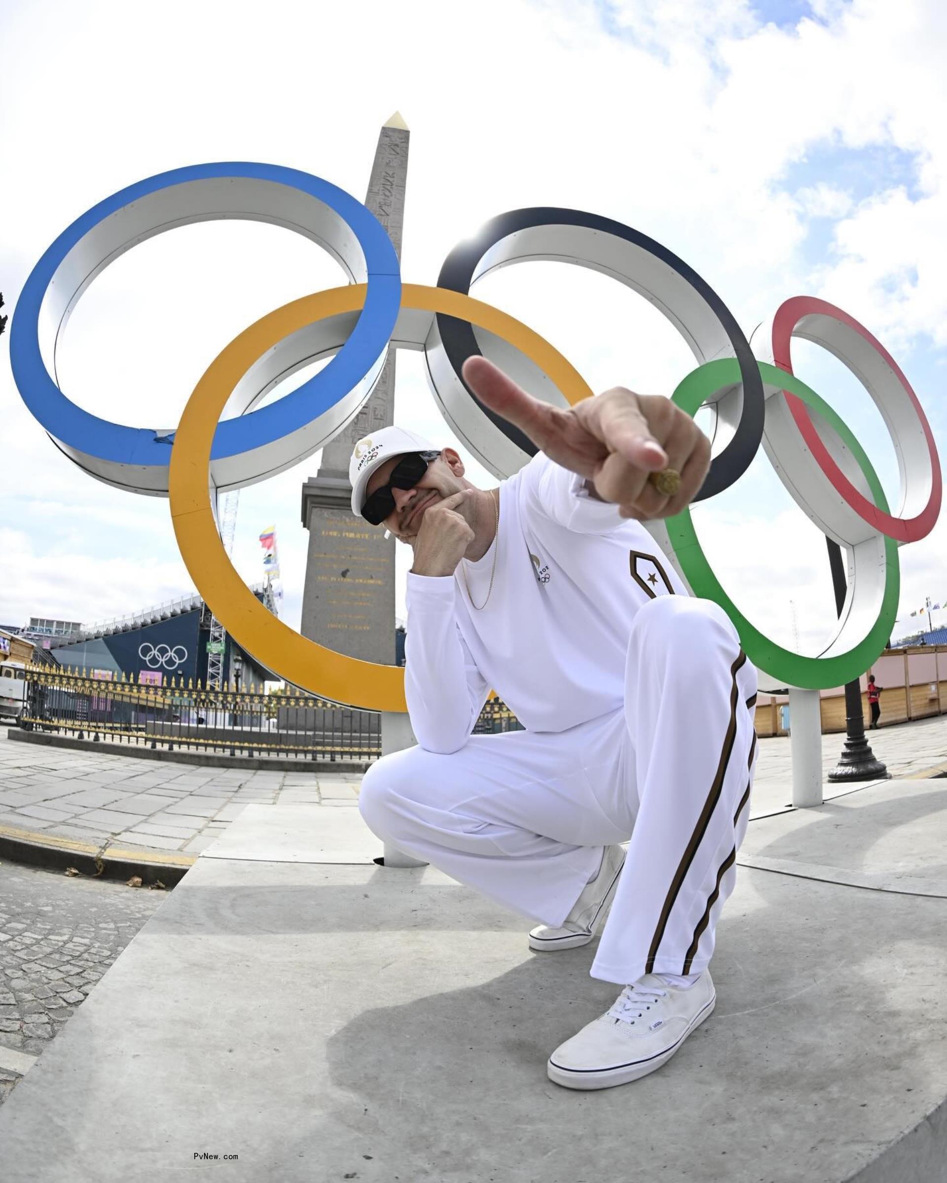 Martin Gilian posed in front of Olympic logo.