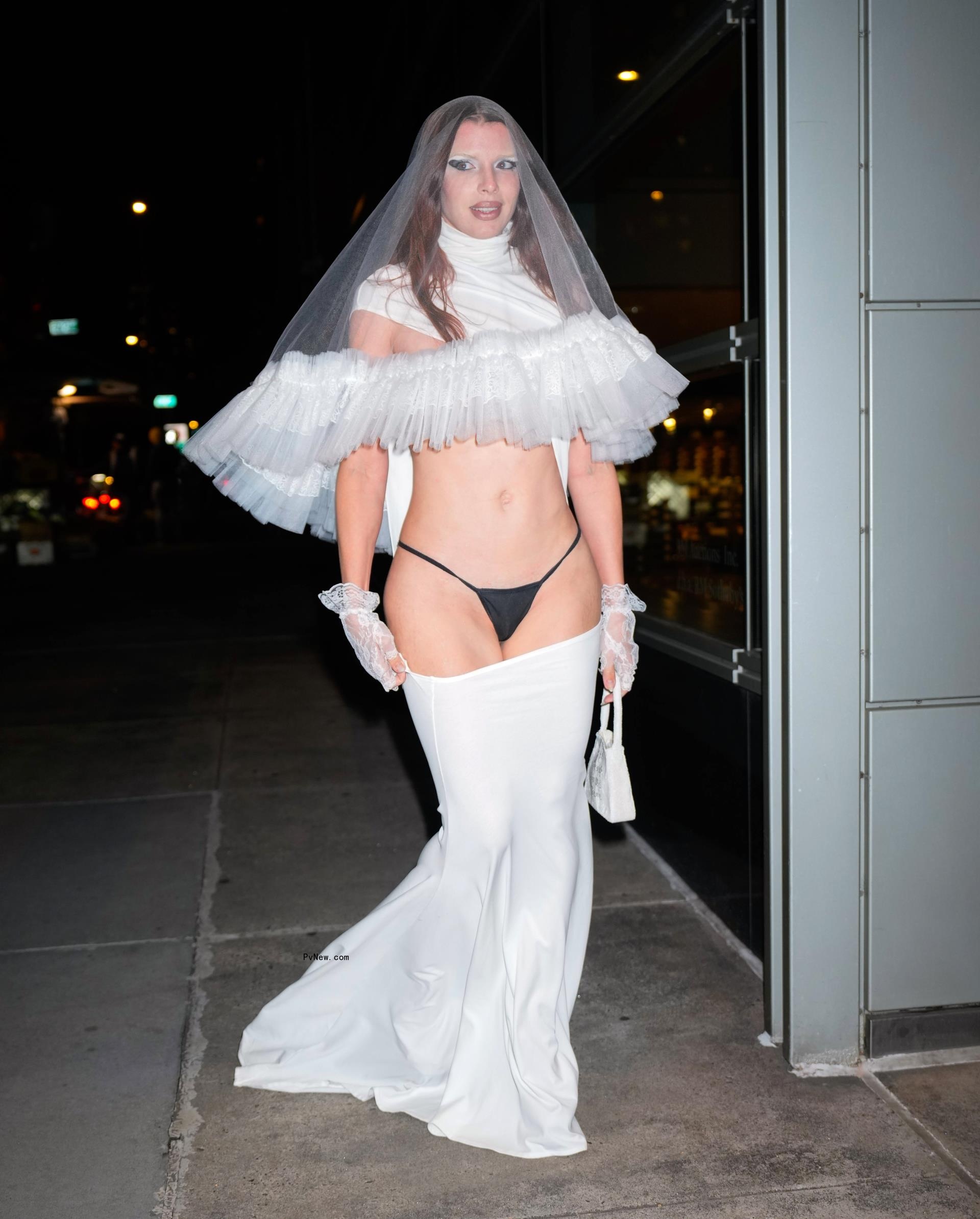 Julia Fox wearing a cutout wedding dress and underwear