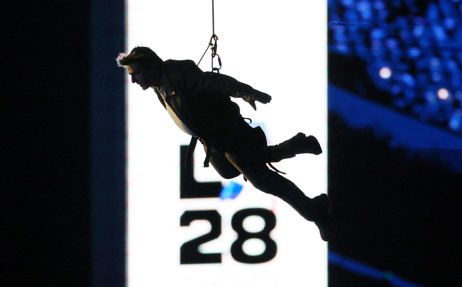 Actor Tom Cruise performs a stunt during the closing ceremony at the Paris 2024 Olympics. 