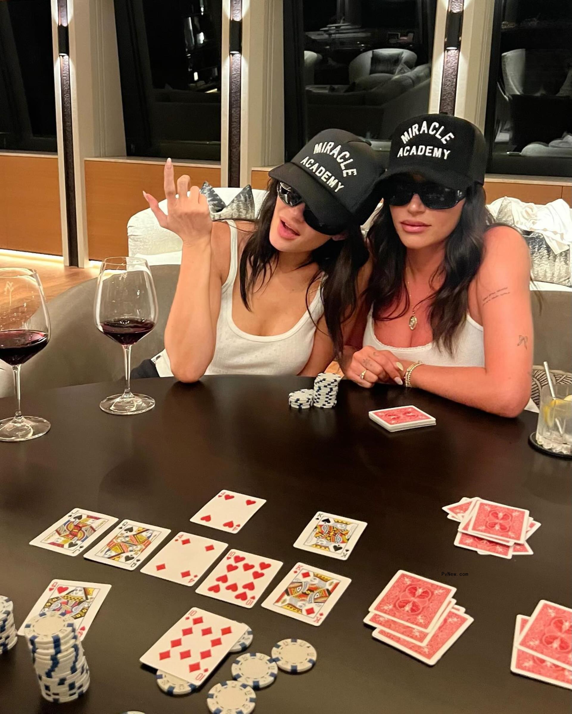 Anastasia Karanikolaou and Kylie Jenner playing poker on a yacht. 