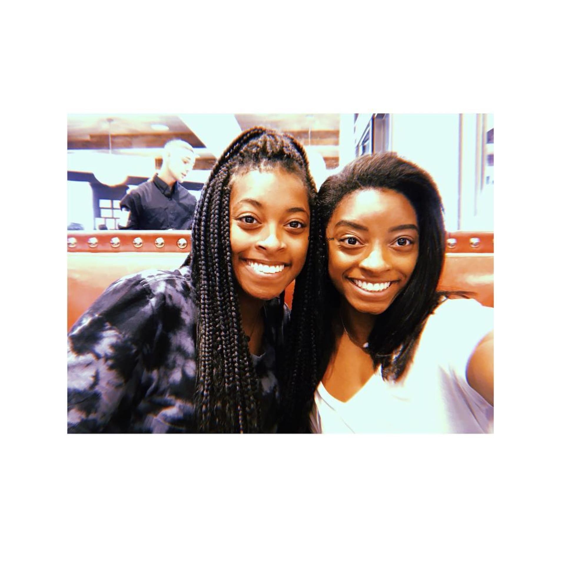 Adria Biles and Simone Biles posing for a selfie