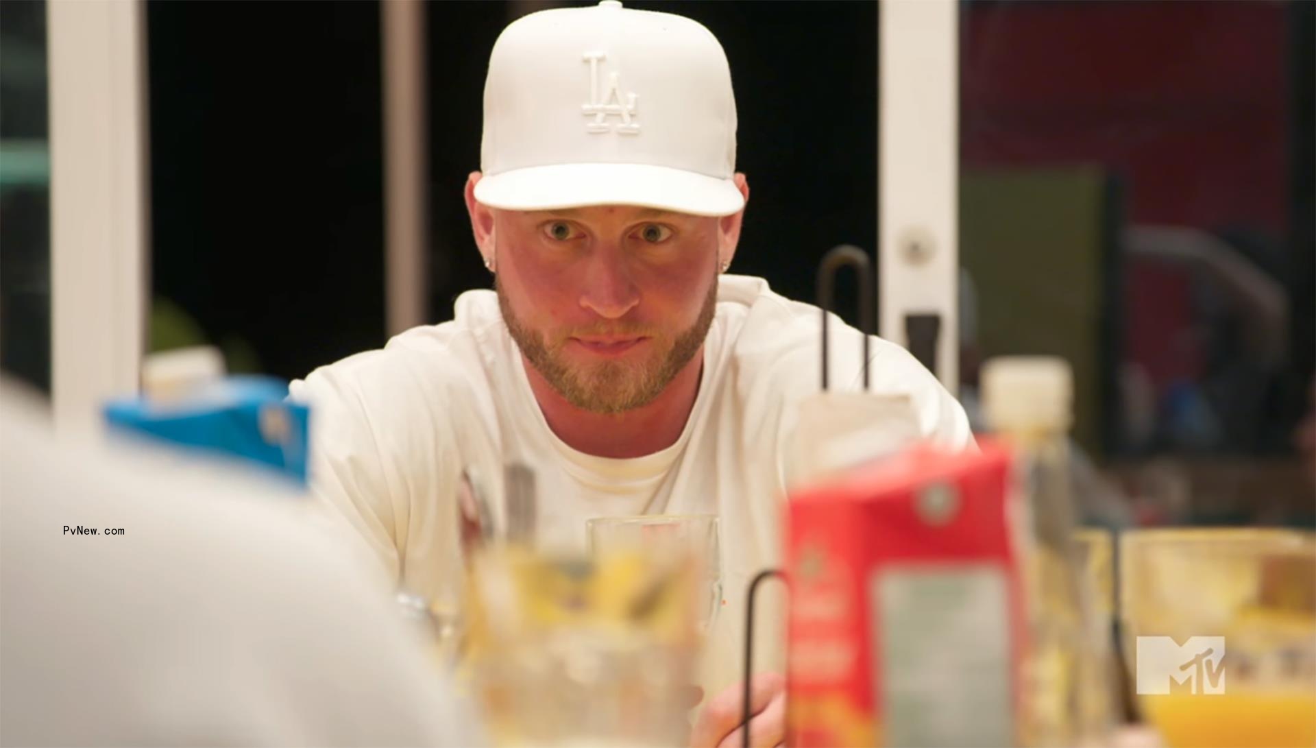 chet hanks sitting at a table