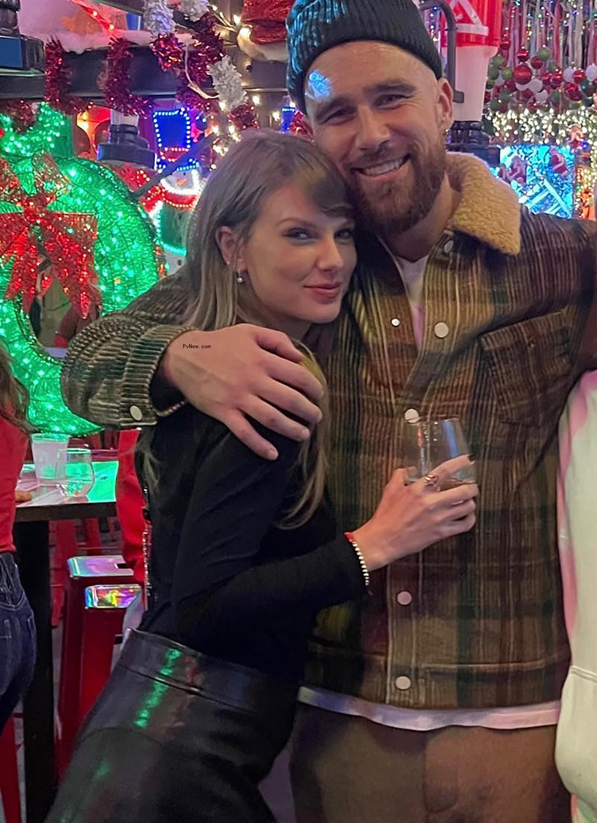 Travis Kelce and Taylor Swift hug
